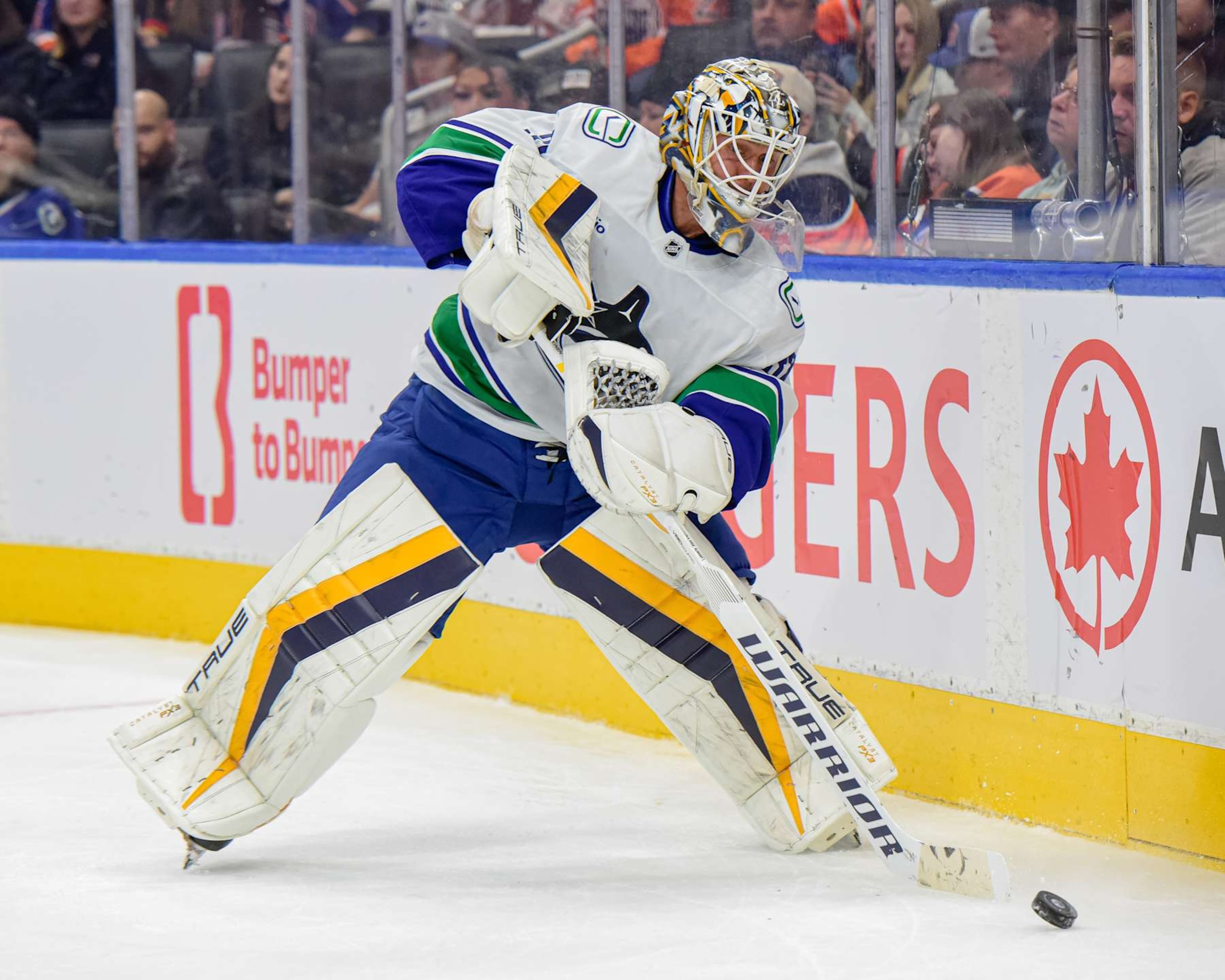 EDMONTON, CANADA  SEPTEMBER 30: Kevin Lankinen #32 of the Vancouver Canucks plays the puck behind his net in the second period of a preseason game at Rogers Place on September 30, 2024, in Edmonton, Alberta, Canada. (Photo by Leila Devlin/Getty Images)