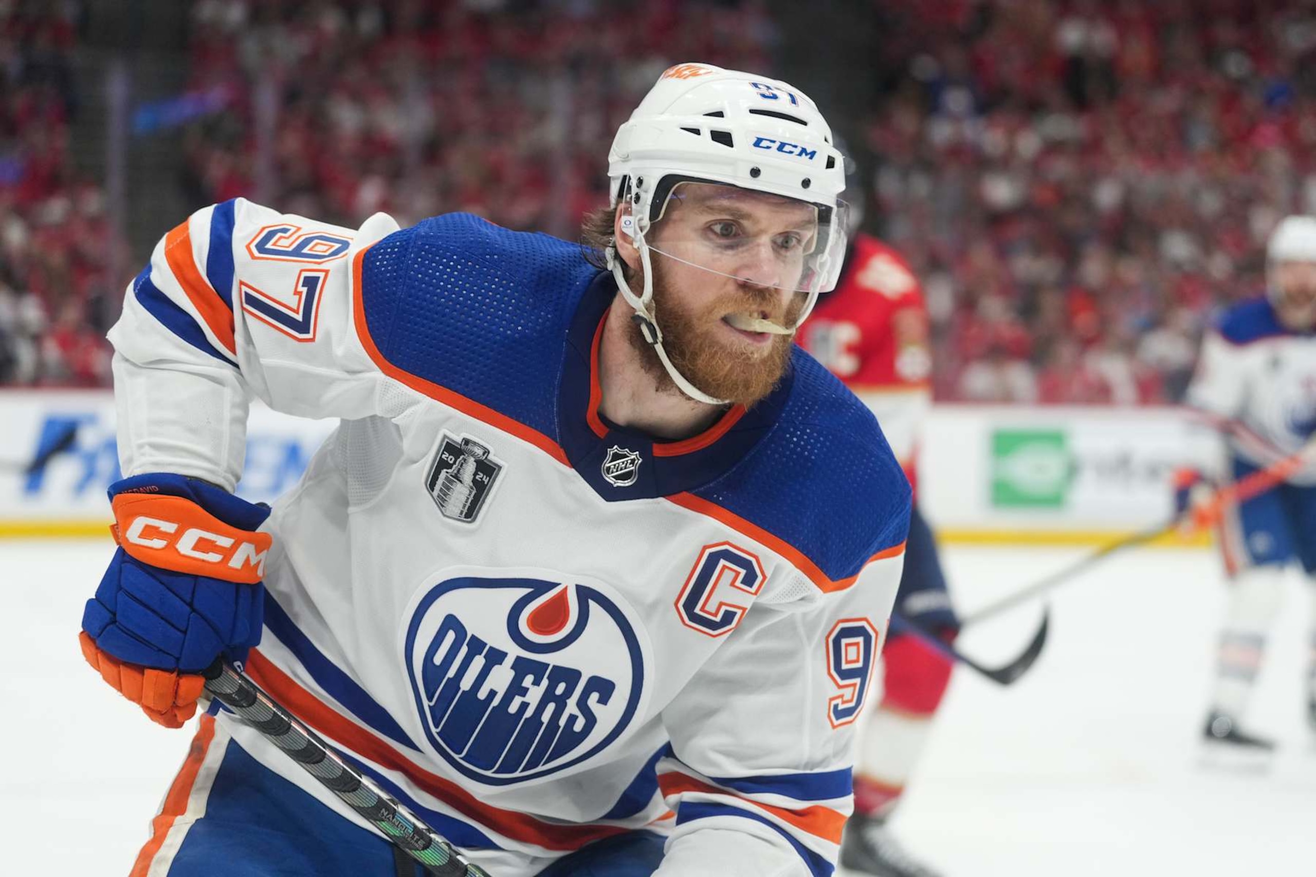 SUNRISE, FL - JUNE 24: Edmonton Oilers center Connor McDavid (97) collects a loose puck in the first period during game seven of the Stanley Cup Finals between the Edmonton Oilers and the Florida Panthers on Monday, June 24, 2024  at Amerant Bank Arena in Sunrise, Fla. (Photo by Peter Joneleit/Icon Sportswire via Getty Images)