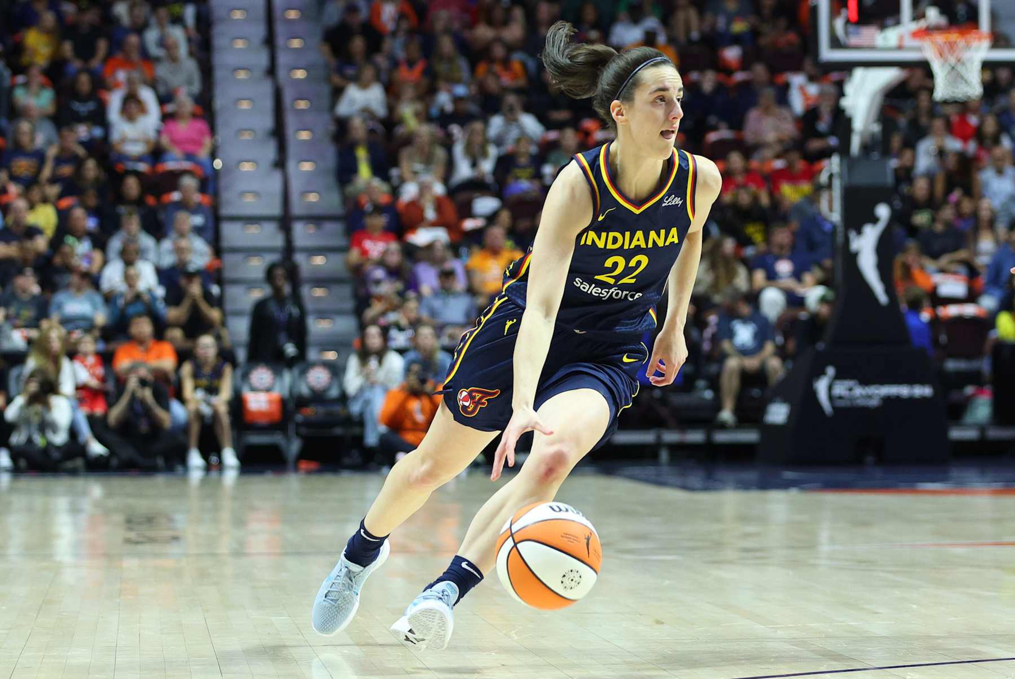 UNCASVILLE, CT - SEPTEMBER 22: Indiana Fever guard Caitlin Clark (22) drives to the basket during the First Round and game 1 of the 2024 WNBA playoffs between Indiana Fever and Connecticut Sun on September 22, 2024, at Mohegan Sun Arena in Uncasville, CT. (Photo by M. Anthony Nesmith/Icon Sportswire via Getty Images) UNCASVILLE, CT - SEPTEMBER 22: Indiana Fever guard Caitlin Clark (22) drives to the basket during the First Round and game 1 of the 2024 WNBA playoffs between Indiana Fever and Connecticut Sun on September 22, 2024, at Mohegan Sun Arena in Uncasville, CT. (Photo by M. Anthony Nesmith/Icon Sportswire via Getty Images)