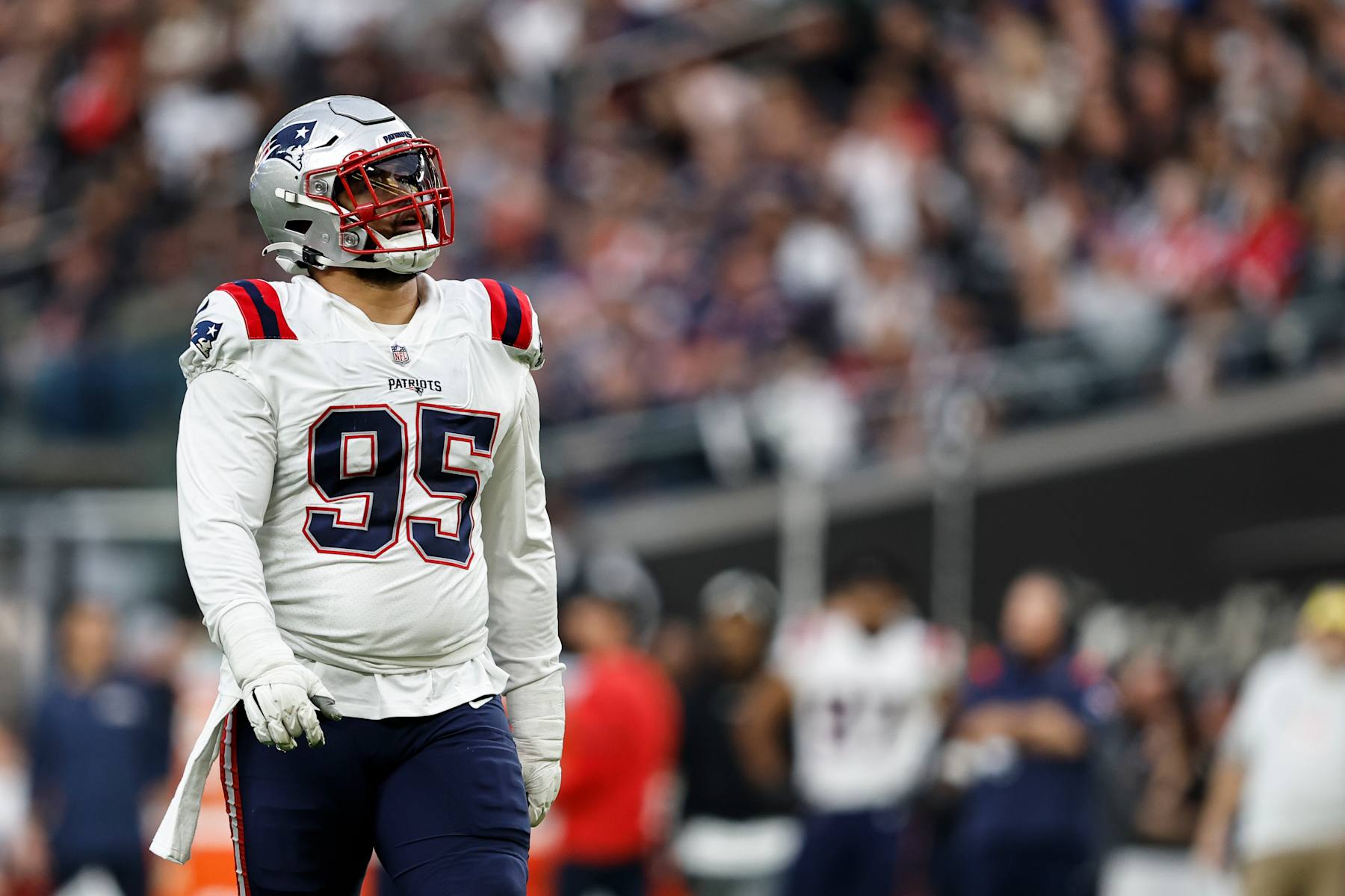 LAS VEGAS, NEVADA - DECEMBER 18: Daniel Ekuale #95 of the New England Patriots looks on during an NFL football game between the Las Vegas Raiders and the New England Patriots at Allegiant Stadium on December 18, 2022 in Las Vegas, Nevada. (Photo by Michael Owens/Getty Images)