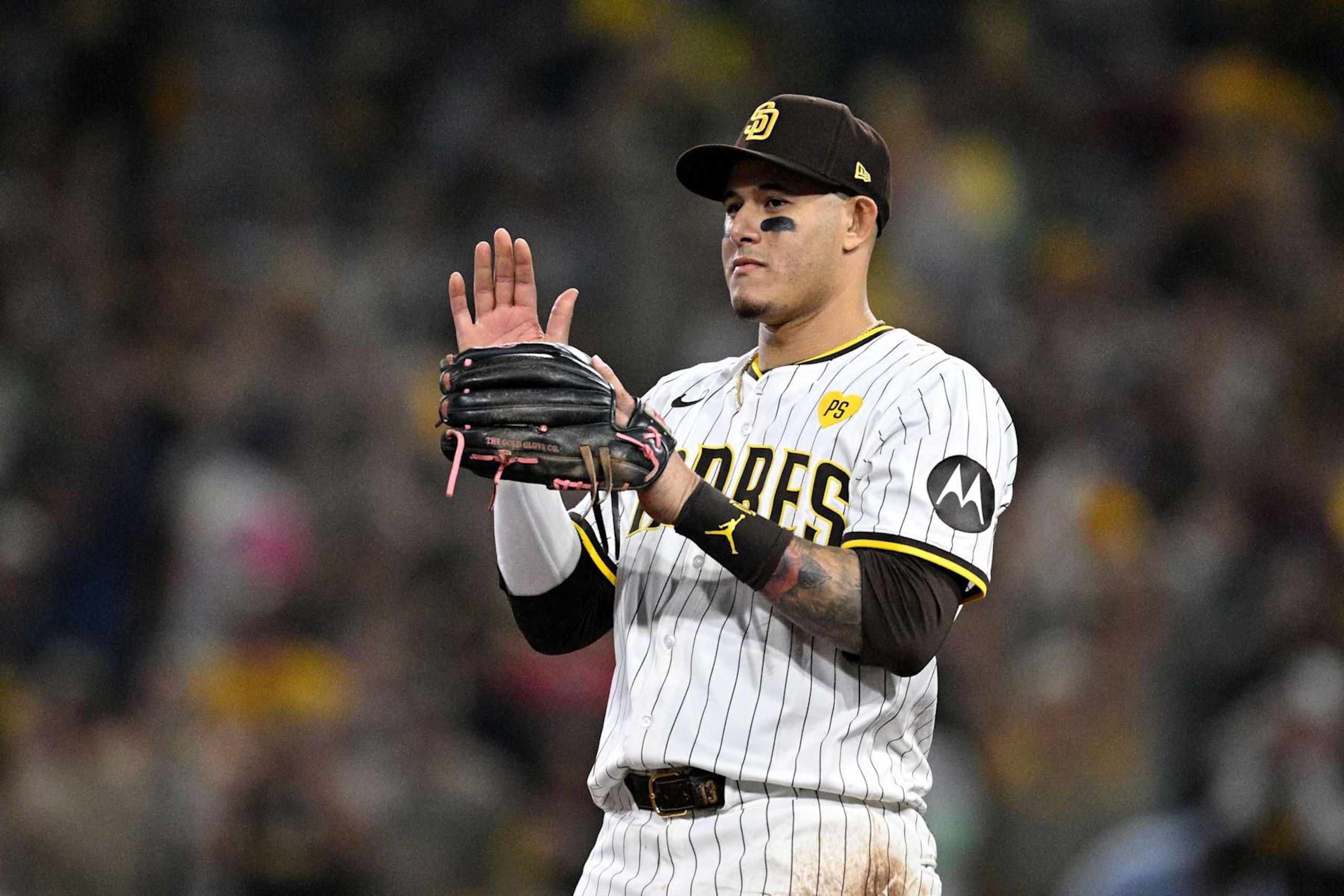SAN DIEGO, CALIFORNIA - OCTOBER 02: Manny Machado #13 of the San Diego Padres reacts against the Atlanta Braves during the sixth inning in Game Two of the Wild Card Series at Petco Park on October 02, 2024 in San Diego, California.  (Photo by Orlando Ramirez/Getty Images)