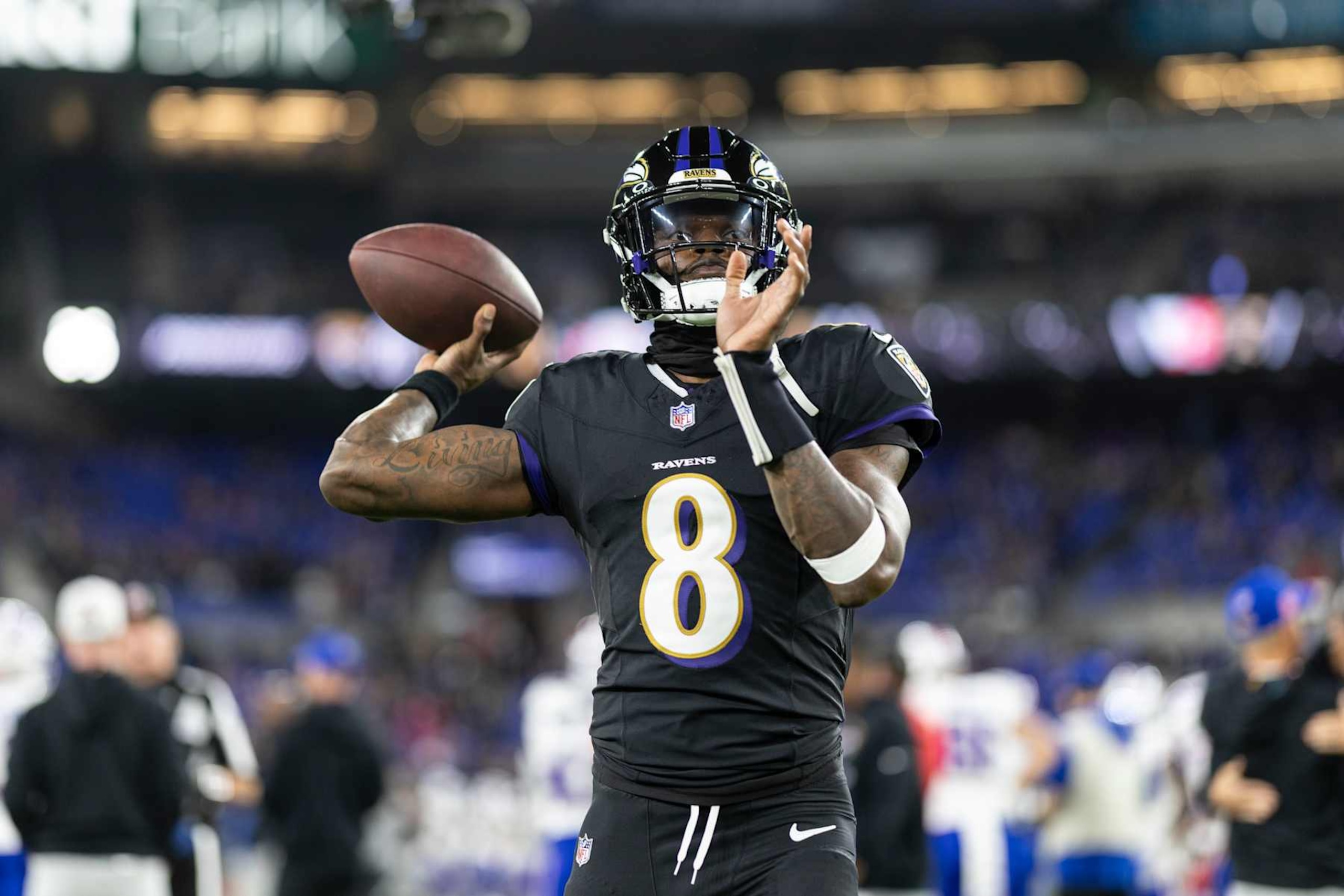 BALTIMORE, MARYLAND - SEPTEMBER 29: Lamar Jackson #8 of the Baltimore Ravens looks to pass as he warms up prior to an NFL football game against the Buffalo Bills at M&T Bank Stadium on September 29, 2024 in Baltimore, Maryland. (Photo by Michael Owens/Getty Images)