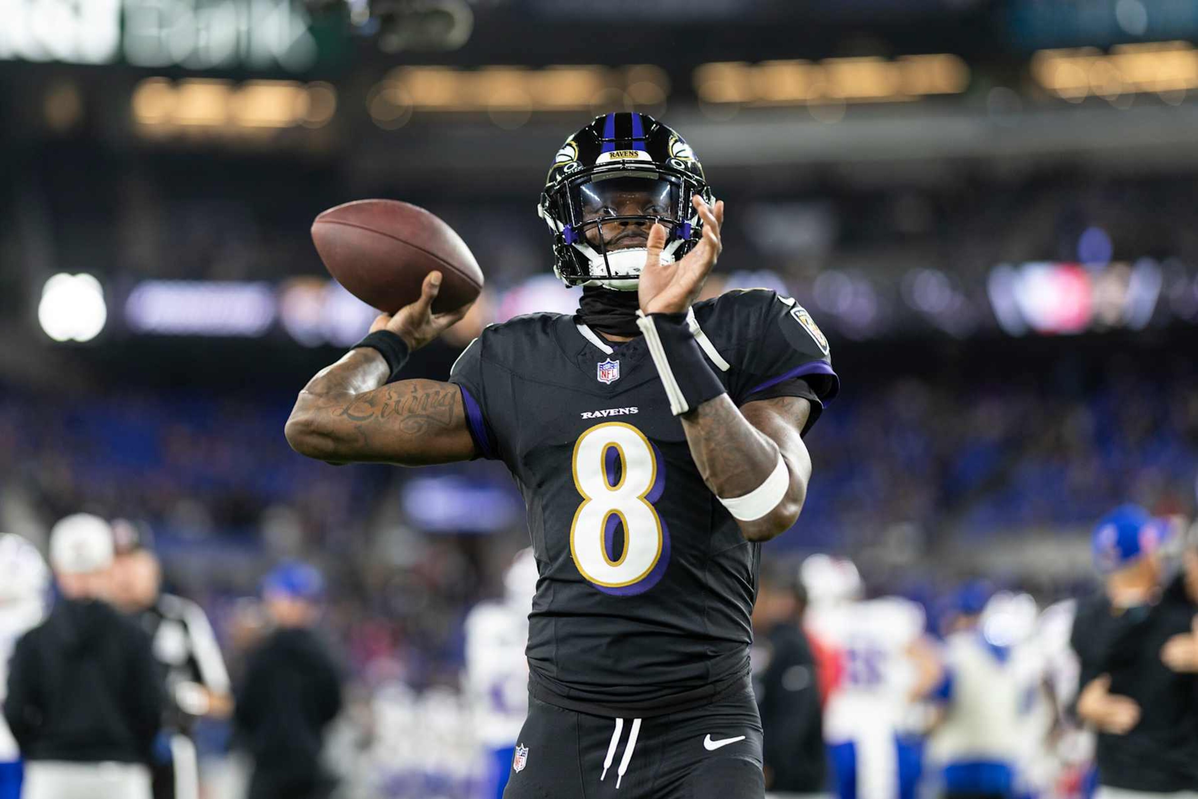 BALTIMORE, MARYLAND - SEPTEMBER 29: Lamar Jackson #8 of the Baltimore Ravens looks to pass as he warms up prior to an NFL football game against the Buffalo Bills at M&T Bank Stadium on September 29, 2024 in Baltimore, Maryland. (Photo by Michael Owens/Getty Images) BALTIMORE, MARYLAND - SEPTEMBER 29: Lamar Jackson #8 of the Baltimore Ravens looks to pass as he warms up prior to an NFL football game against the Buffalo Bills at M&T Bank Stadium on September 29, 2024 in Baltimore, Maryland. (Photo by Michael Owens/Getty Images)