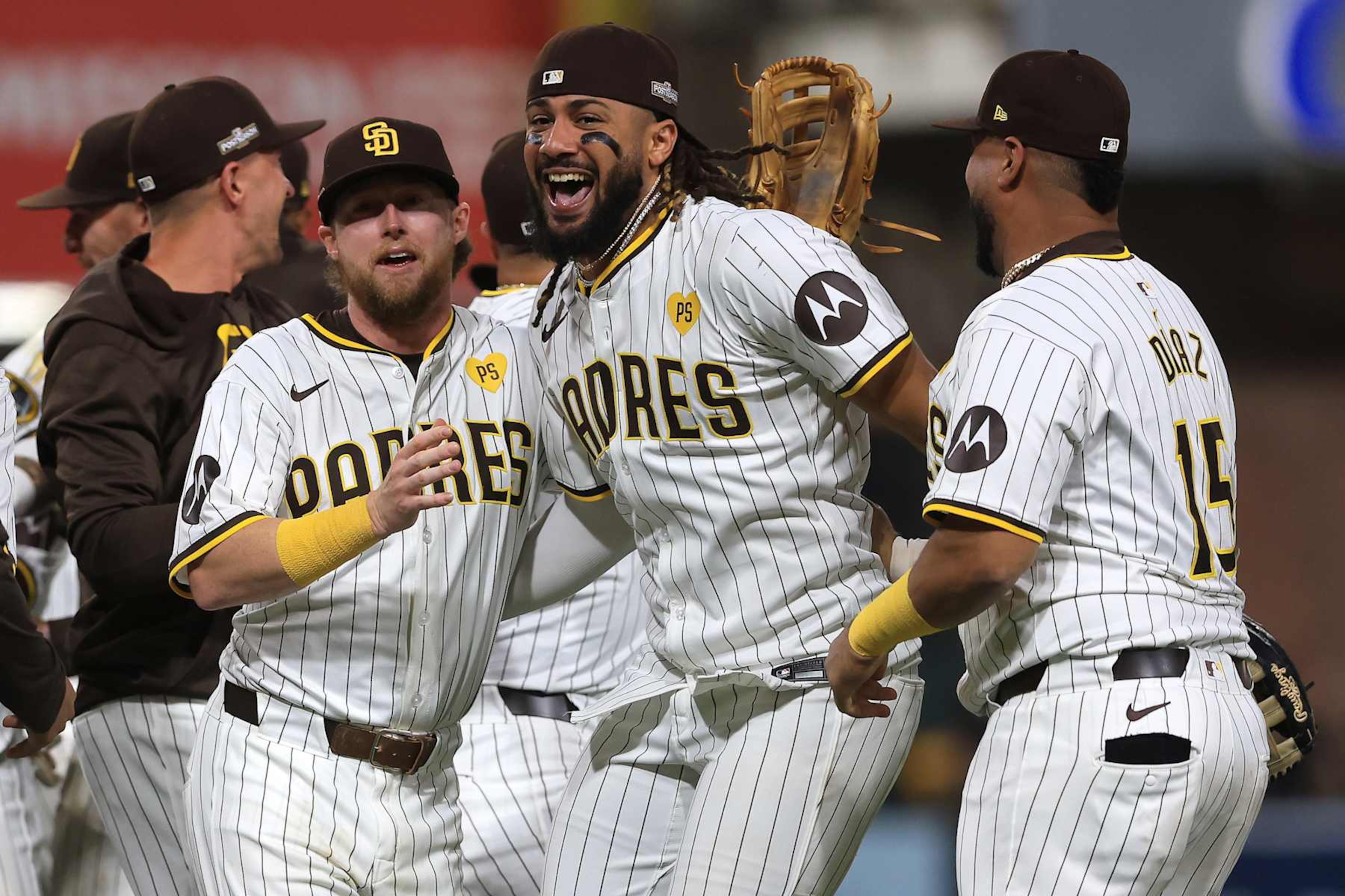 Jake Cronenworth (L), Fernando Tatis Jr. (C) and Elias Díaz (R)