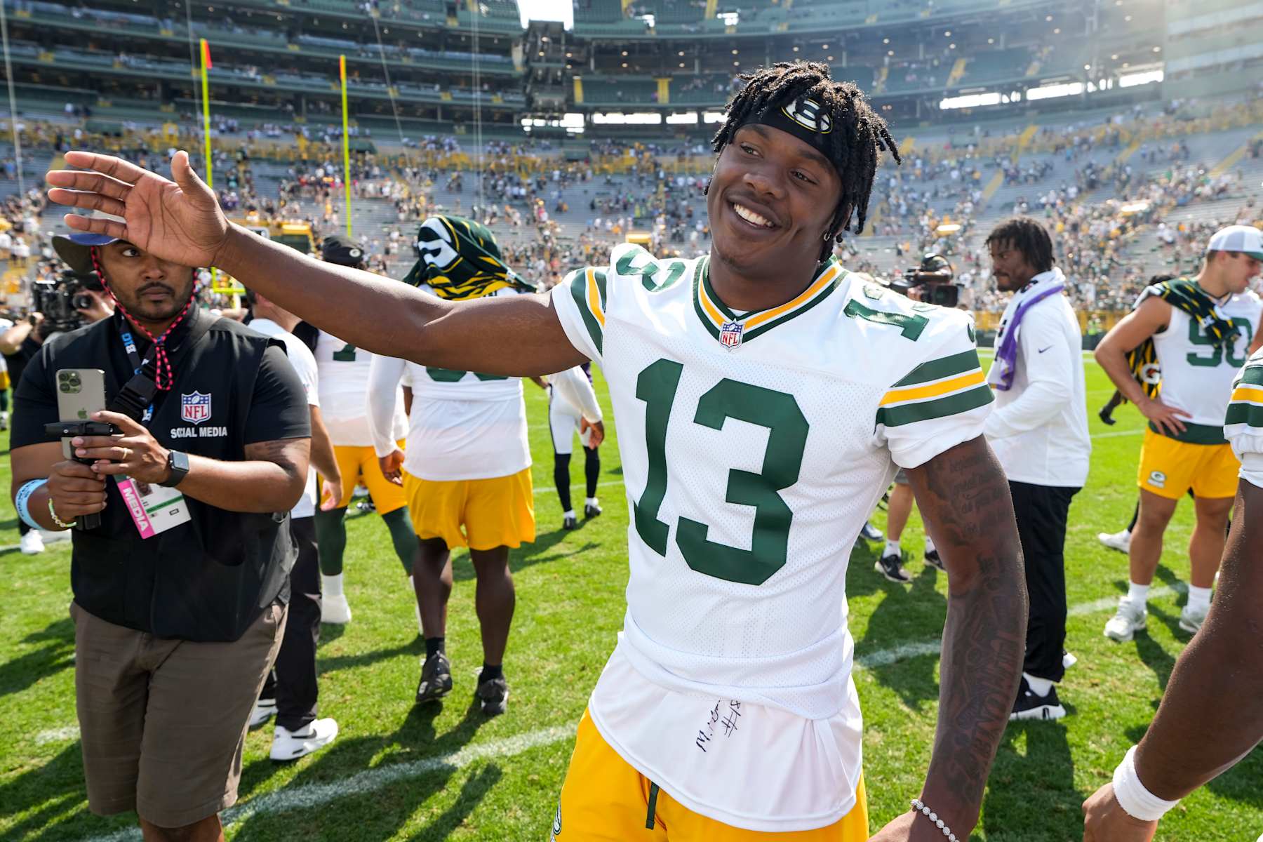 GREEN BAY, WISCONSIN - AUGUST 24: Wide receiver Dontayvion Wicks #13 of the Green Bay Packers stands on the field after an NFL preseason football game against the Baltimore Ravens, at Lambeau Field on August 24, 2024 in Green Bay, Wisconsin. (Photo by Todd Rosenberg/Getty Images)