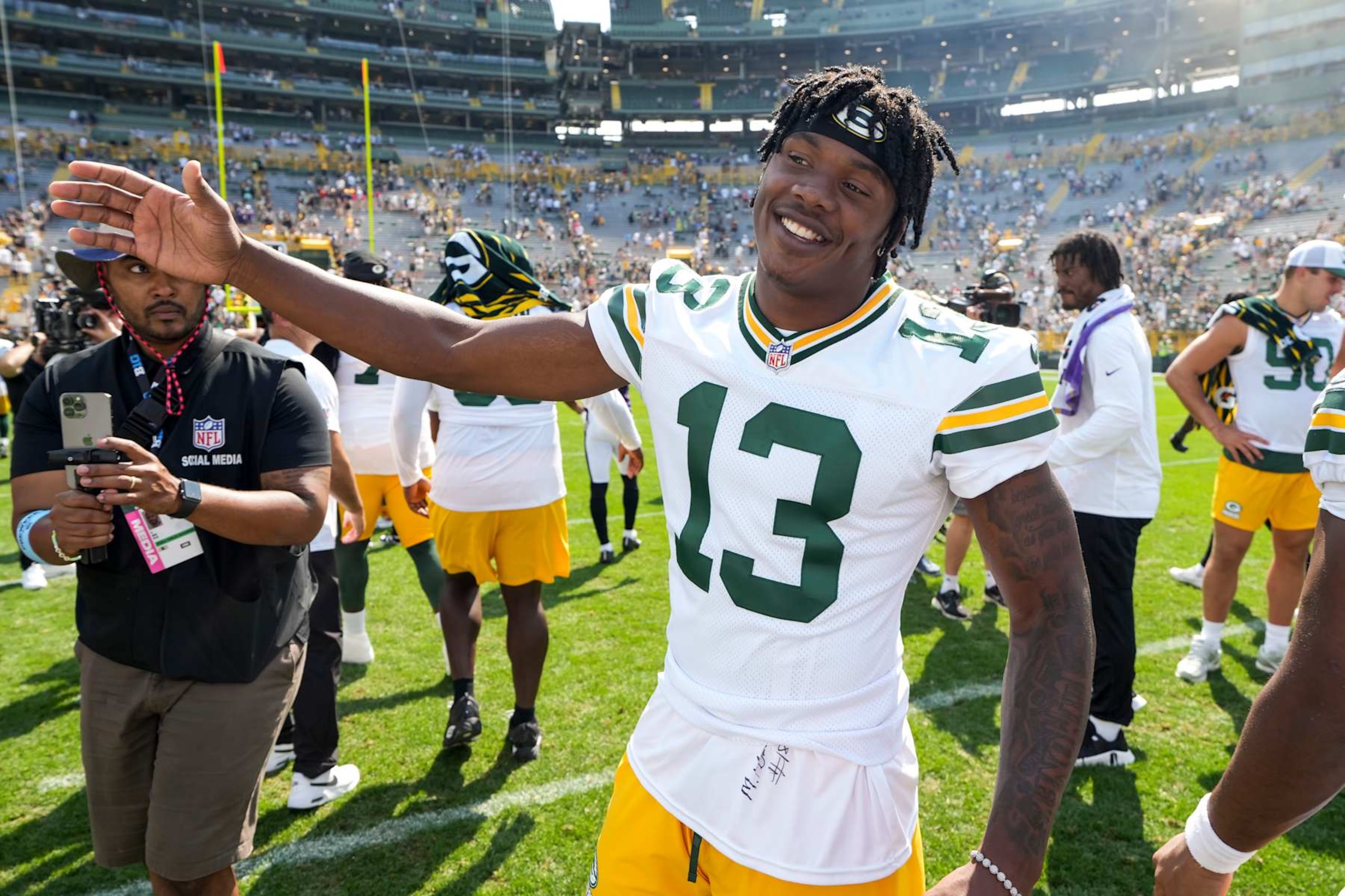 GREEN BAY, WISCONSIN - AUGUST 24: Wide receiver Dontayvion Wicks #13 of the Green Bay Packers stands on the field after an NFL preseason football game against the Baltimore Ravens, at Lambeau Field on August 24, 2024 in Green Bay, Wisconsin. (Photo by Todd Rosenberg/Getty Images)