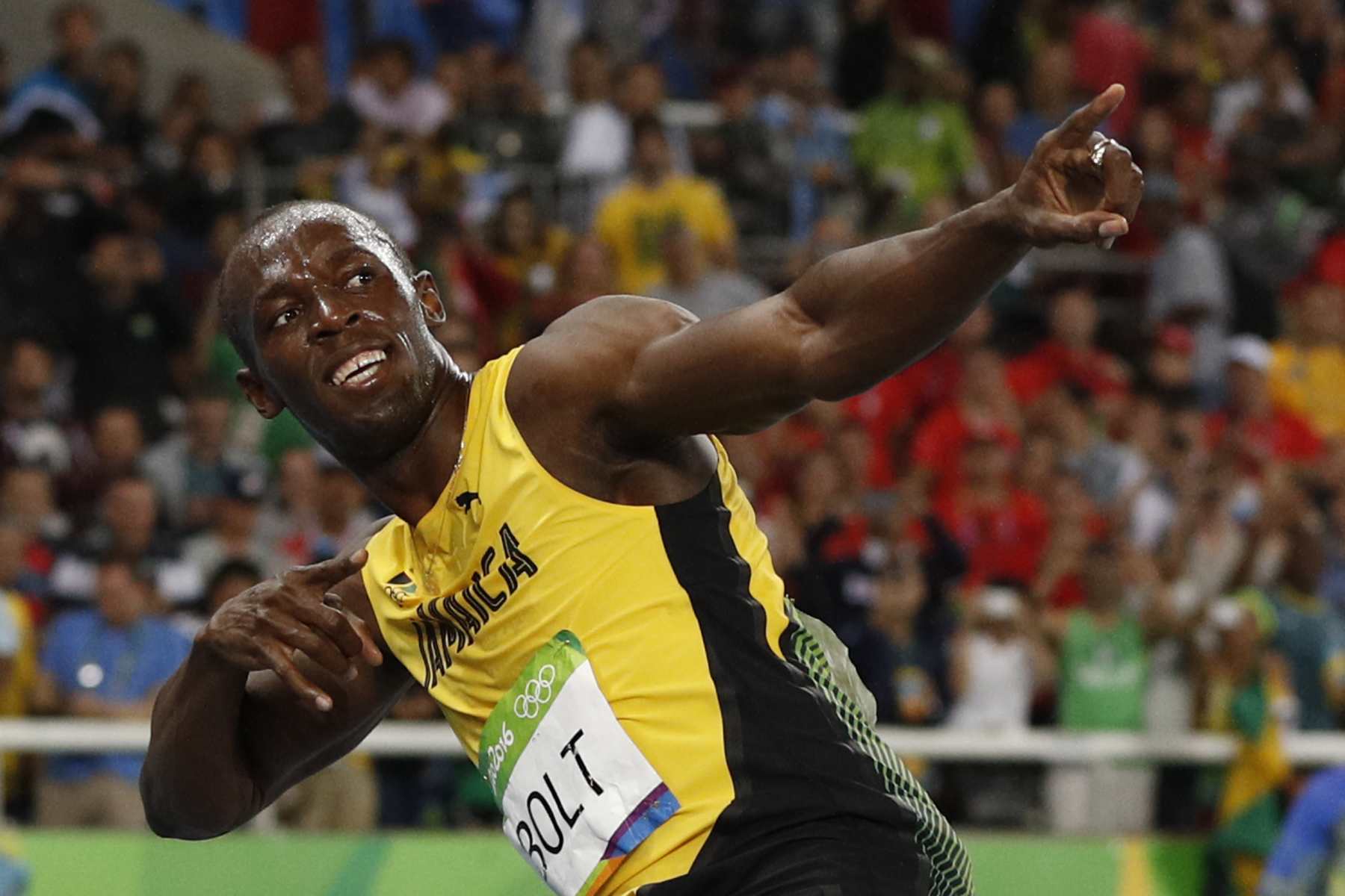Jamaica's Usain Bolt does his "Lightening Bolt" pose after he won the Men's 200m Final during the athletics event at the Rio 2016 Olympic Games at the Olympic Stadium in Rio de Janeiro on August 18, 2016.   / AFP PHOTO / Adrian DENNIS        (Photo credit should read ADRIAN DENNIS/AFP via Getty Images)