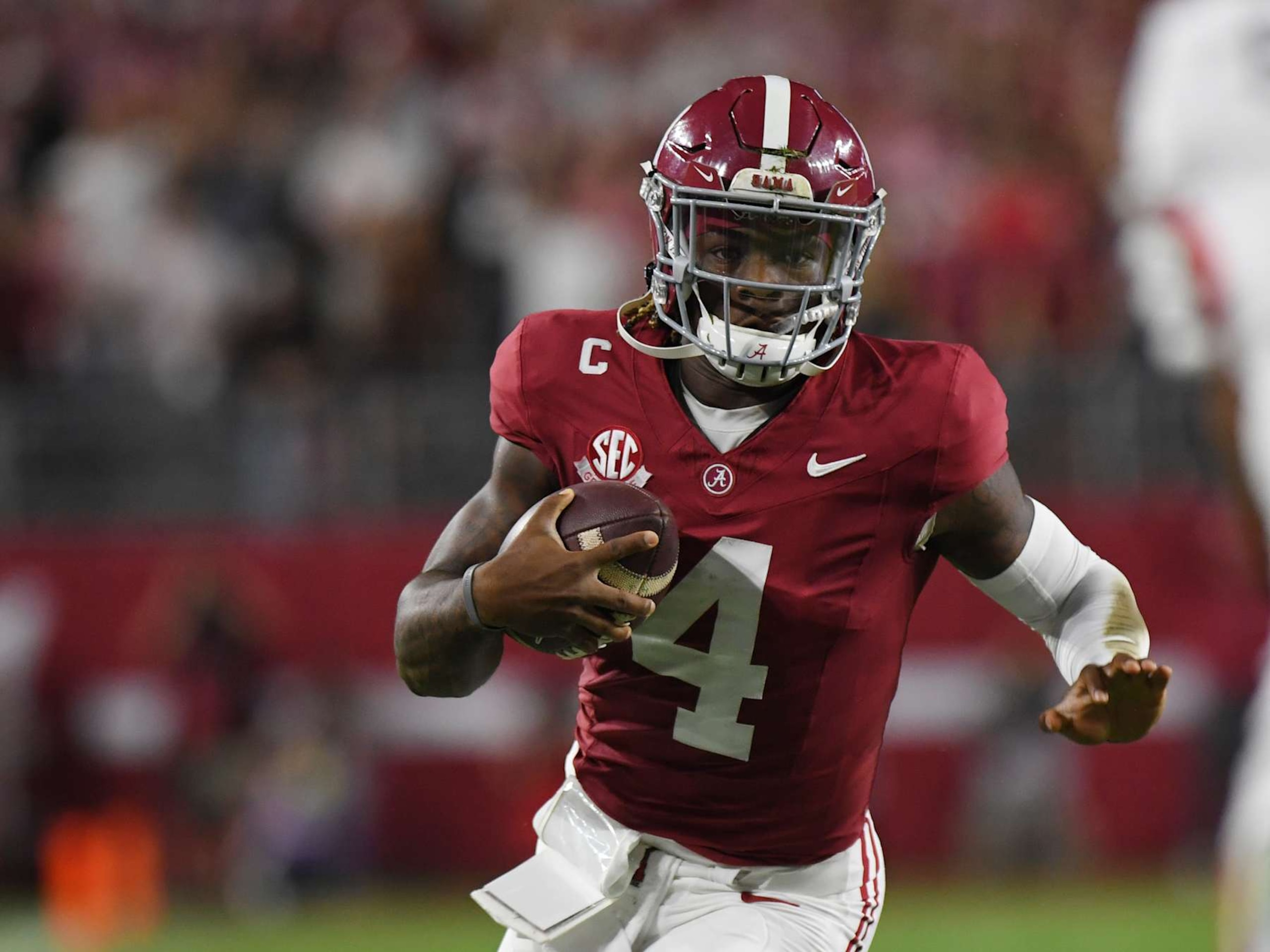 TUSCALOOSA, AL - SEPTEMBER 28: Alabama Crimson Tide quarterback Jalen Milroe (4) rushes the ball during the college football game between the Georgia Bulldogs and the Alabama Crimson Tide on September 28, 2024, at Bryant-Denny Stadium in Tuscaloosa, AL. (Photo by Jeffrey Vest/Icon Sportswire via Getty Images)