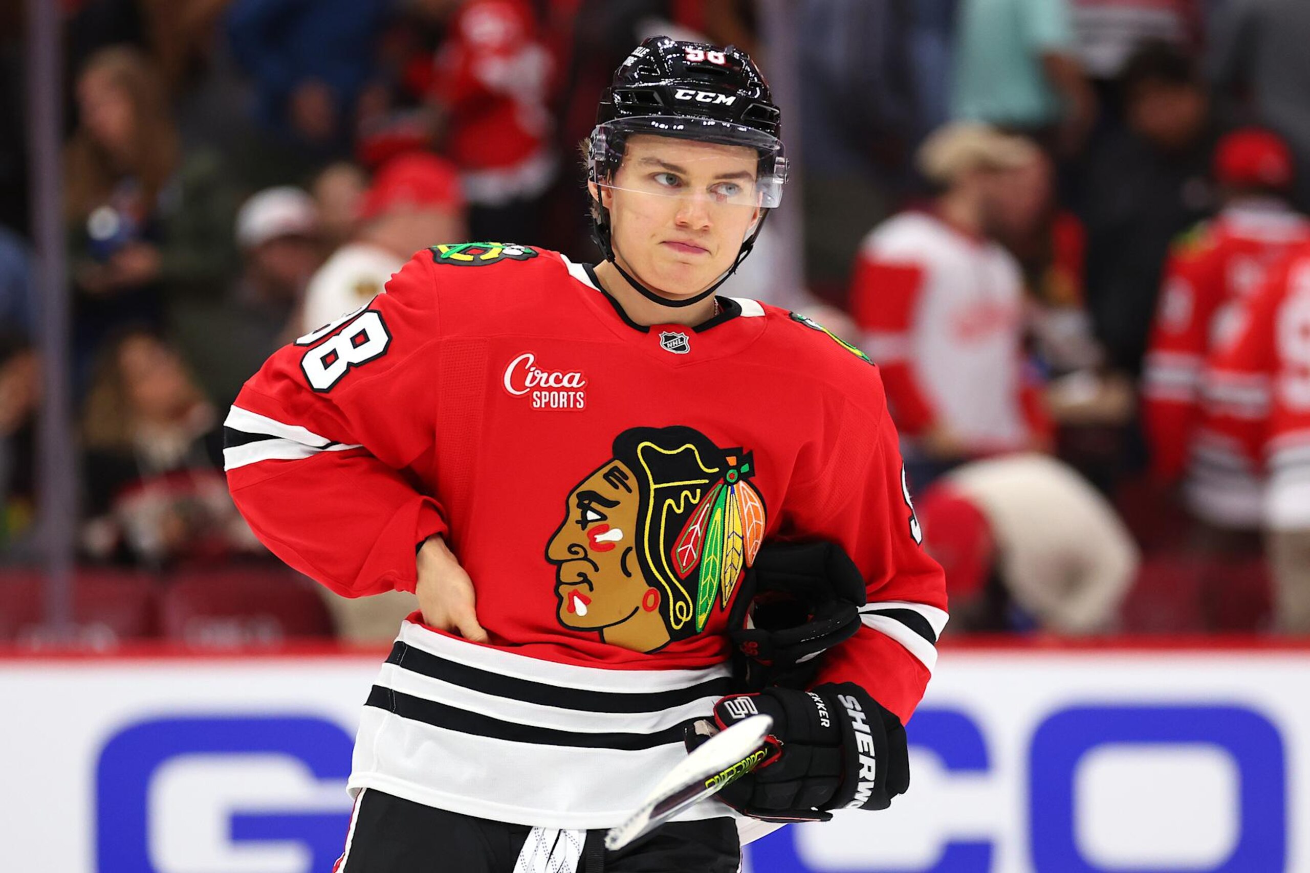 CHICAGO, ILLINOIS - SEPTEMBER 25: Connor Bedard #98 of the Chicago Blackhawks reacts after losing a preseason game against the Detroit Red Wings at the United Center on September 25, 2024 in Chicago, Illinois.  (Photo by Michael Reaves/Getty Images)