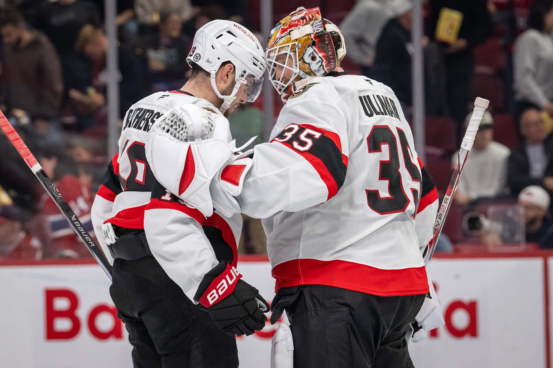 MONTREAL, QC - OCTOBER 01: Drake Batherson (19) of the Ottawa Senators bumps helmets with teammate Linus Ullmark (35)  during the third period of the NHL pre-season game between the Ottawa Senators and the Montreal Canadiens on Oct 1, 2024, at the Bell Centre in Montreal, QC(Photo by Vincent Ethier/Icon Sportswire via Getty Images)
