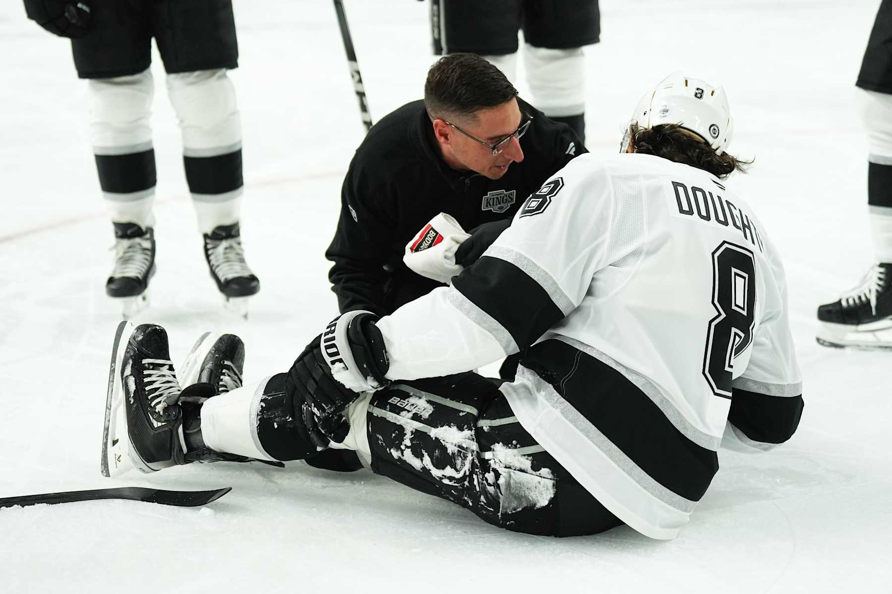 LAS VEGAS, NEVADA - SEPTEMBER 25: Drew Doughty #8 of the Los Angeles Kings reacts after suffering an injury during the first period against the Vegas Golden Knights at T-Mobile Arena on September 25, 2024 in Las Vegas, Nevada.  (Photo by Jeff Bottari/NHLI via Getty Images)