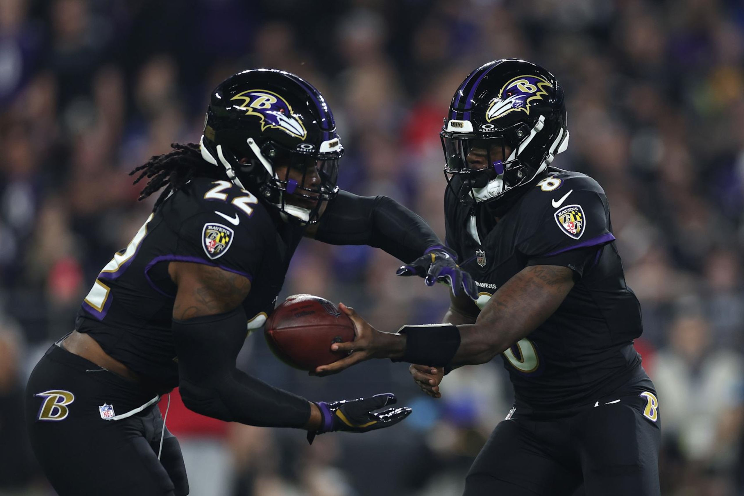 BALTIMORE, MARYLAND - SEPTEMBER 29: Lamar Jackson #8 of the Baltimore Ravens hands the ball off to Derrick Henry #22 of the Baltimore Ravens during the first quarter against the Buffalo Bills at M&T Bank Stadium on September 29, 2024 in Baltimore, Maryland. (Photo by Patrick Smith/Getty Images)