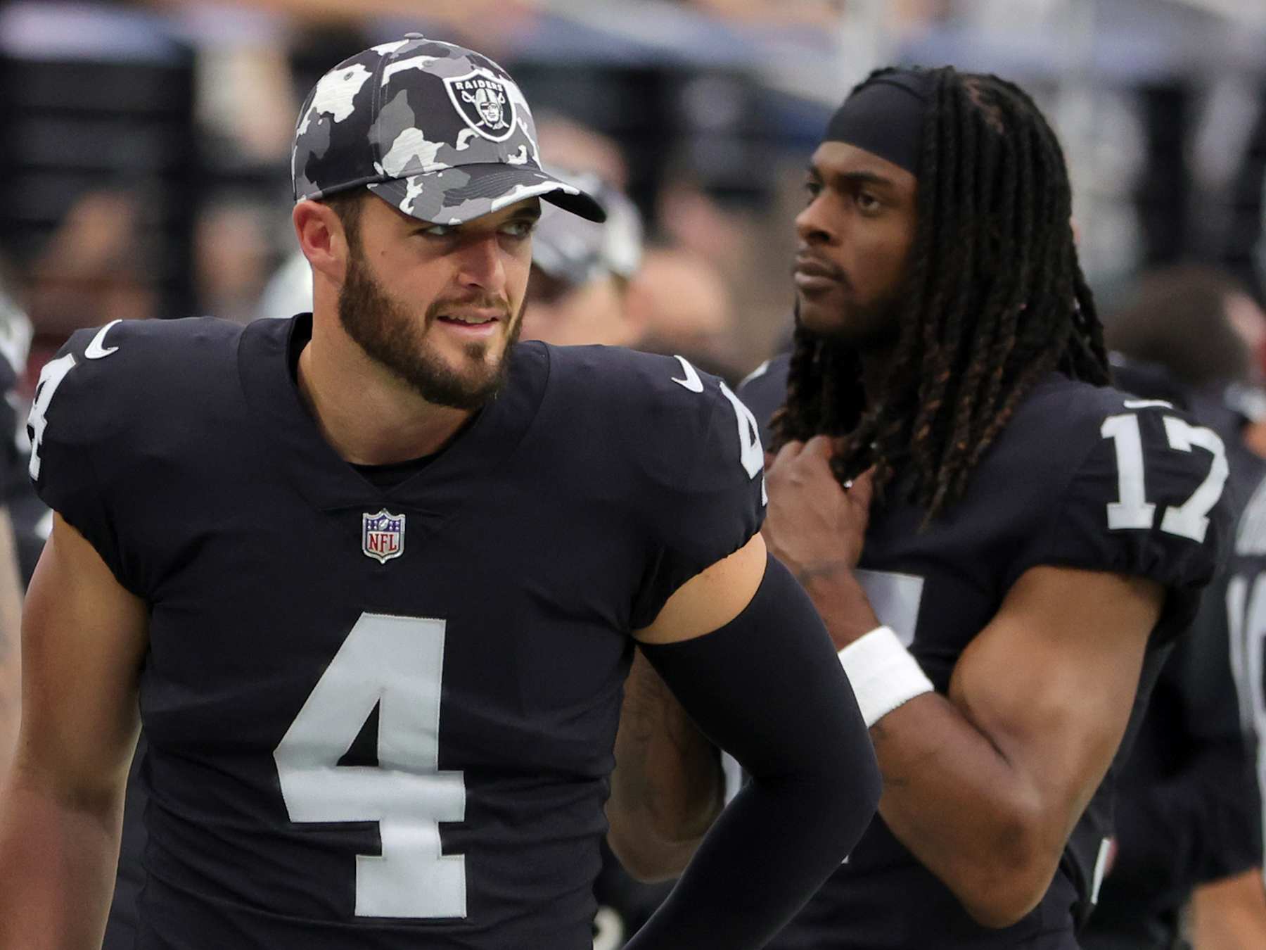 LAS VEGAS, NEVADA - AUGUST 14: Quarterback Derek Carr #4 and wide receiver Davante Adams #17 of the Las Vegas Raiders stand on a sideline during a preseason game against the Minnesota Vikings at Allegiant Stadium on August 14, 2022 in Las Vegas, Nevada. The Raiders defeated Vikings the 26-20. (Photo by Ethan Miller/Getty Images)