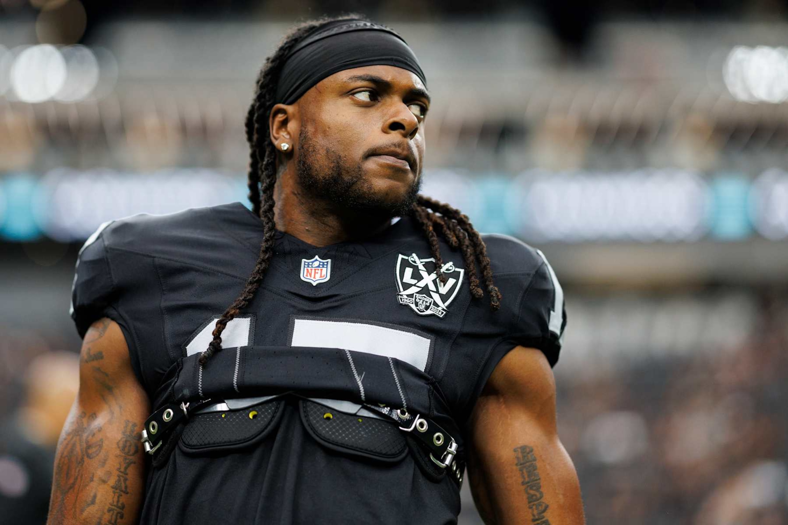 LAS VEGAS, NEVADA - SEPTEMBER 22: Wide receiver Davante Adams #17 of the Las Vegas Raiders stretches prior to an NFL football game against the Carolina Panthers, at Allegiant Stadium on September 22, 2024 in Las Vegas, Nevada. (Photo by Brooke Sutton/Getty Images) LAS VEGAS, NEVADA - SEPTEMBER 22: Wide receiver Davante Adams #17 of the Las Vegas Raiders stretches prior to an NFL football game against the Carolina Panthers, at Allegiant Stadium on September 22, 2024 in Las Vegas, Nevada. (Photo by Brooke Sutton/Getty Images)