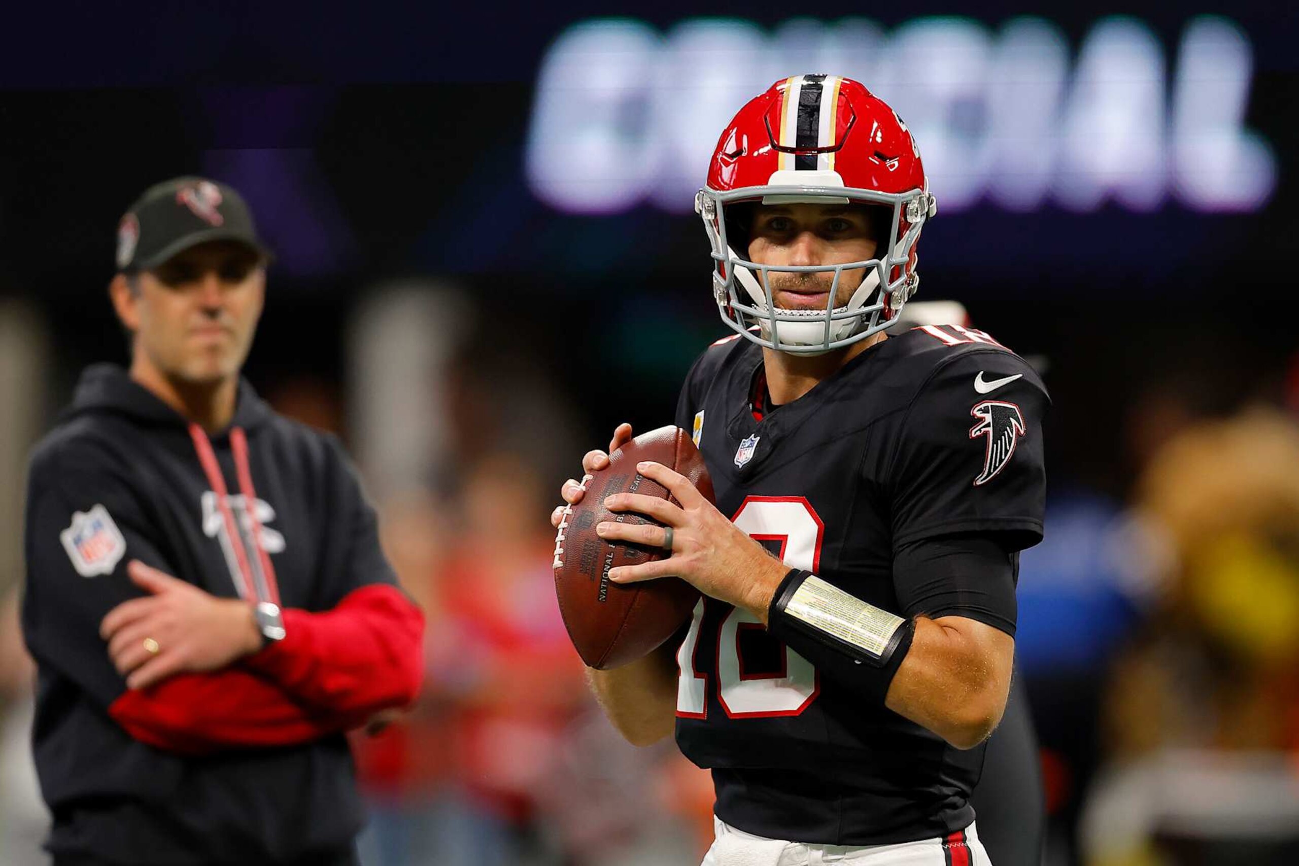 ATLANTA, GEORGIA - SEPTEMBER 29: Kirk Cousins (18) of the Atlanta Falcons warms up against the New Orleans Saints at Mercedes-Benz Stadium on September 29, 2024 in Atlanta, Georgia. (Photo by Todd Kirkland/Getty Images)