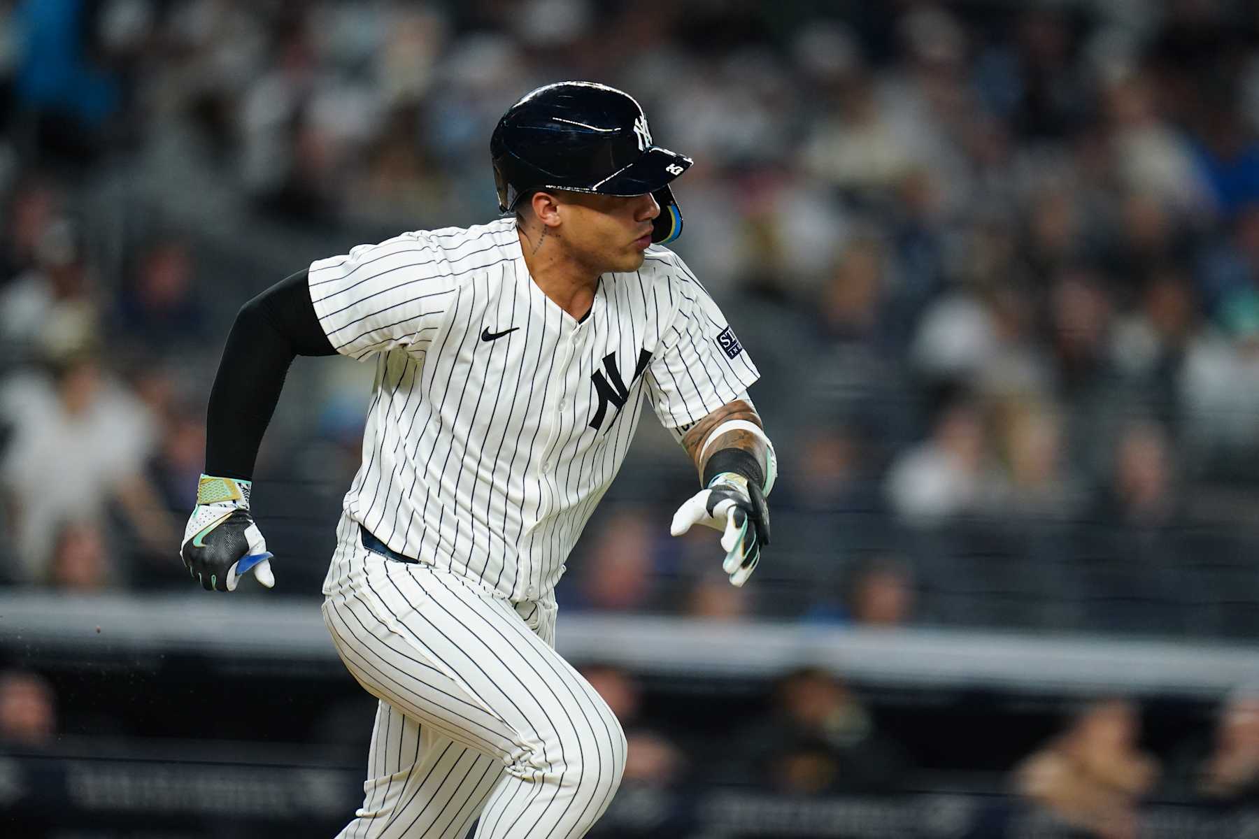 NEW YORK, NY - SEPTEMBER 27: Gleyber Torres #25 of the New York Yankees runs to first base after hitting a single in the third inning during the game between the Pittsburgh Pirates and the New York Yankees at Yankee Stadium on Friday, September 27, 2024 in New York, New York. (Photo by Emma Corona/MLB Photos via Getty Images)