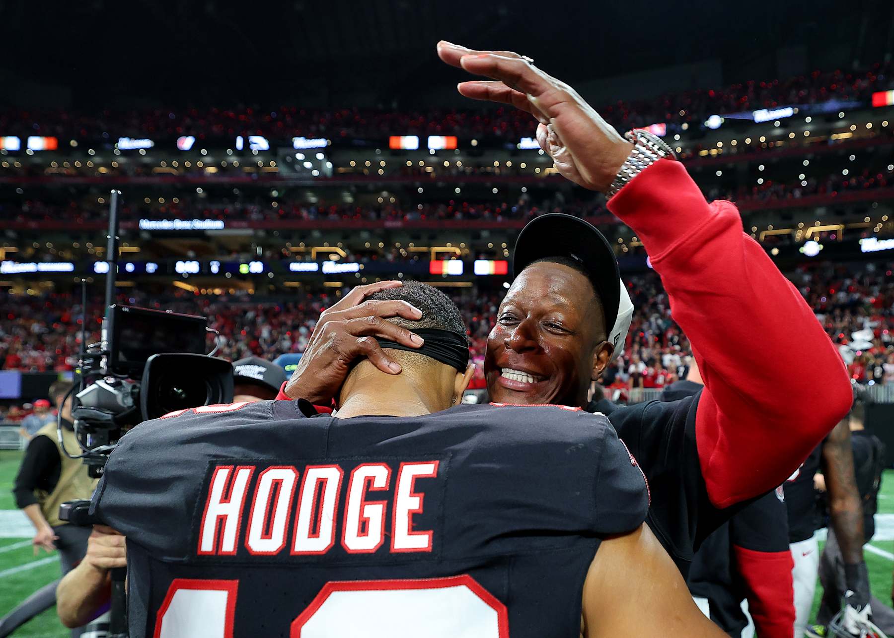 ATLANTA, GEORGIA - OCTOBER 03: Head coach Raheem Morris of the Atlanta Falcons celebrates with KhaDarel Hodge #12 after defeating the Tampa Bay Buccaneers in overtime at Mercedes-Benz Stadium on October 03, 2024 in Atlanta, Georgia. (Photo by Kevin C. Cox/Getty Images)