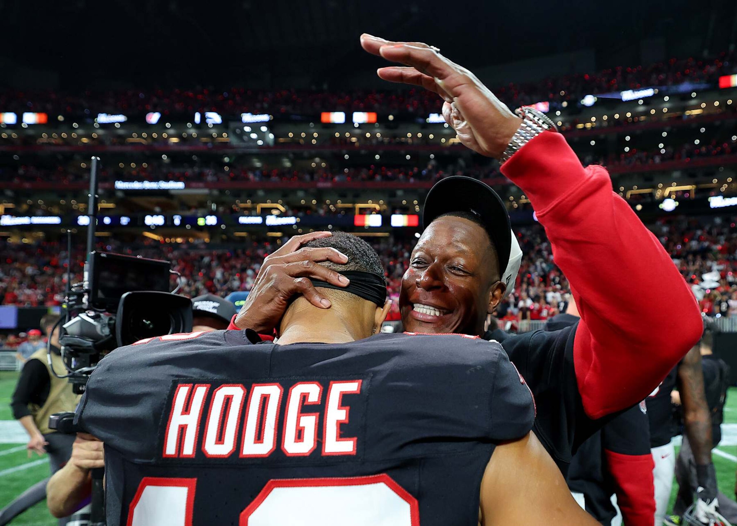 ATLANTA, GEORGIA - OCTOBER 03: Head coach Raheem Morris of the Atlanta Falcons celebrates with KhaDarel Hodge #12 after defeating the Tampa Bay Buccaneers in overtime at Mercedes-Benz Stadium on October 03, 2024 in Atlanta, Georgia. (Photo by Kevin C. Cox/Getty Images)