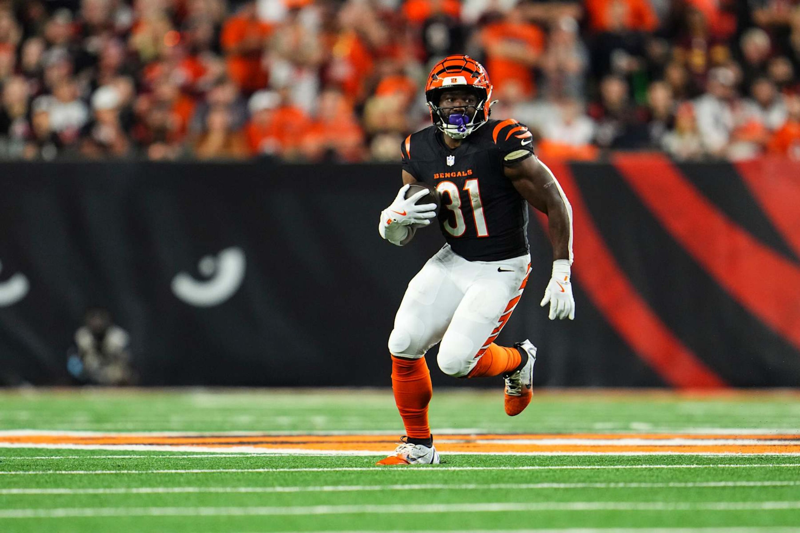 CINCINNATI, OH - SEPTEMBER 23: Zack Moss #31 of the Cincinnati Bengals runs the ball during an NFL football game against the Washington Commanders at Paycor Stadium on September 23, 2024 in Cincinnati, Ohio. (Photo by Cooper Neill/Getty Images)