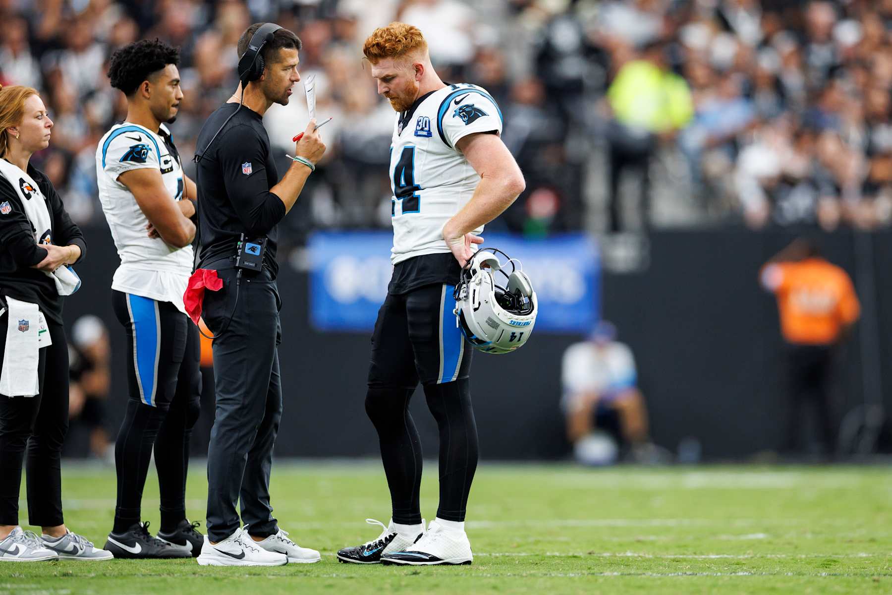 LAS VEGAS, NEVADA - SEPTEMBER 22: (L-R) Head coach Dave Canales of the Carolina Panthers speaks with quarterback Andy Dalton #14 on the field during the third quarter of an NFL football game against the Las Vegas Raiders, at Allegiant Stadium on September 22, 2024 in Las Vegas, Nevada. (Photo by Brooke Sutton/Getty Images)