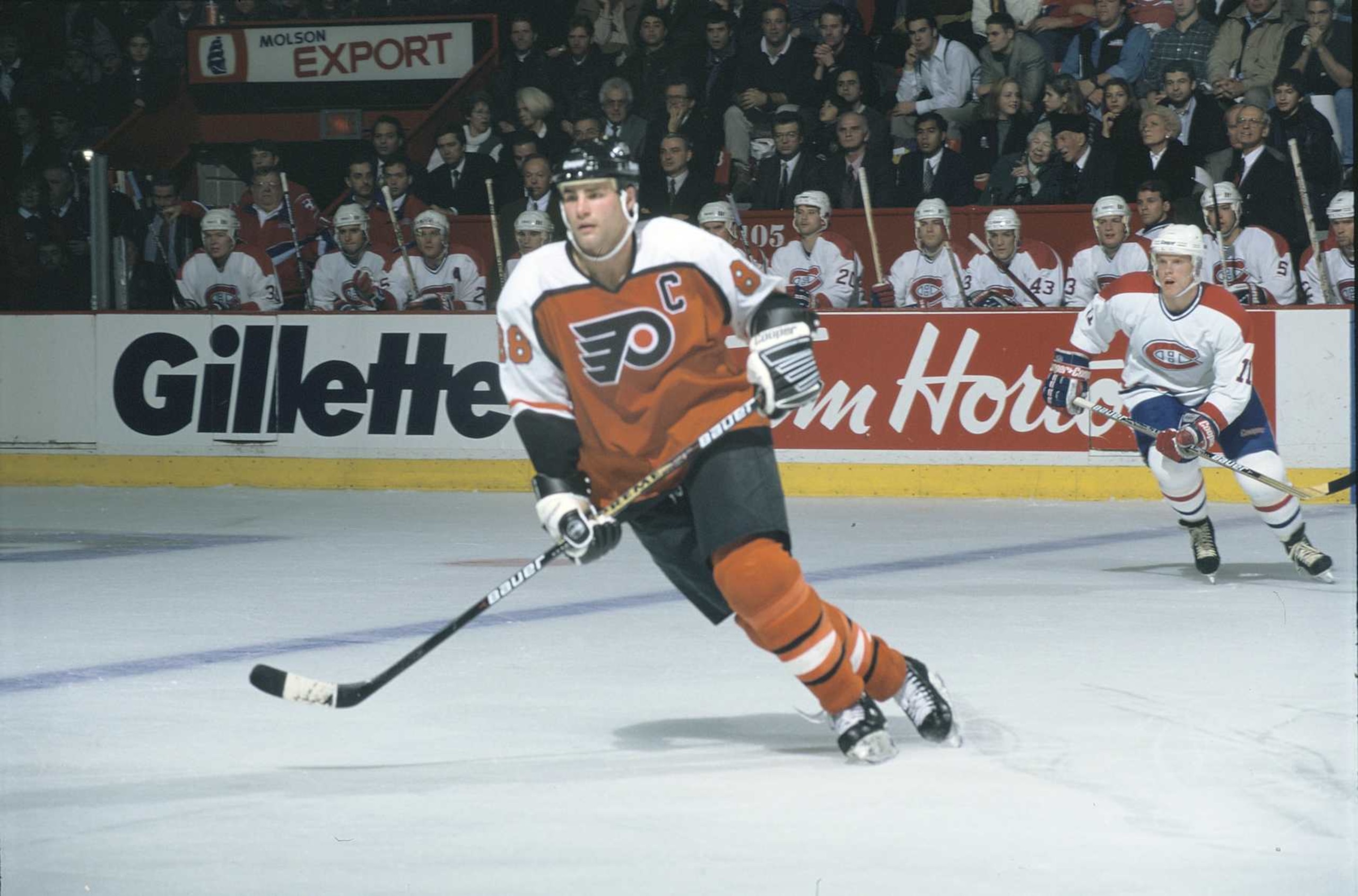 Flyers captain Eric Lindros #88 and Canadiens forward Saku Koivu #11 in a game at the Montreal Forum during the 1995-96 season (Photo by Denis Brodeur/NHLI via Getty Images)