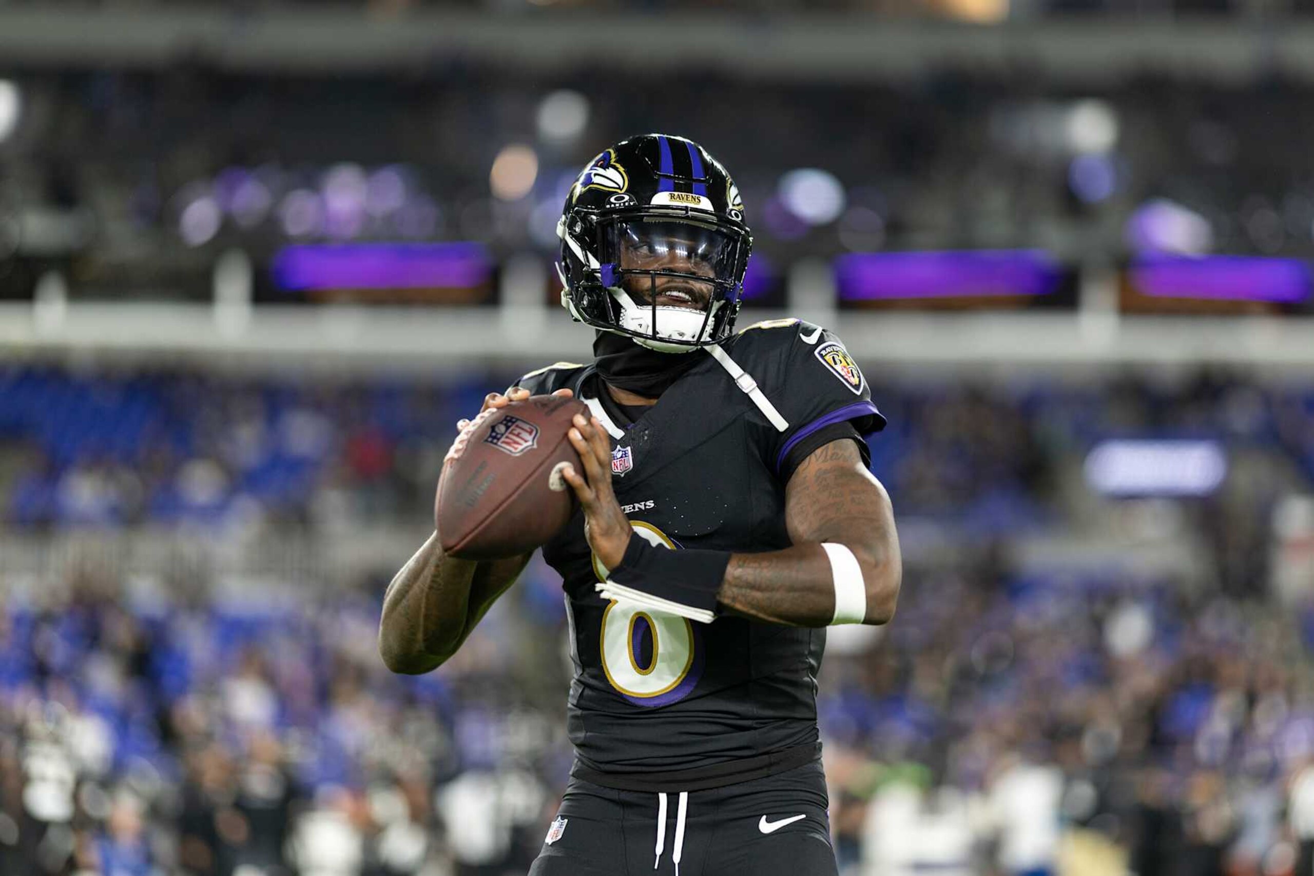 BALTIMORE, MARYLAND - SEPTEMBER 29: Lamar Jackson #8 of the Baltimore Ravens looks to pass as he warms up prior to an NFL football game against the Buffalo Bills at M&T Bank Stadium on September 29, 2024 in Baltimore, Maryland. (Photo by Michael Owens/Getty Images)
