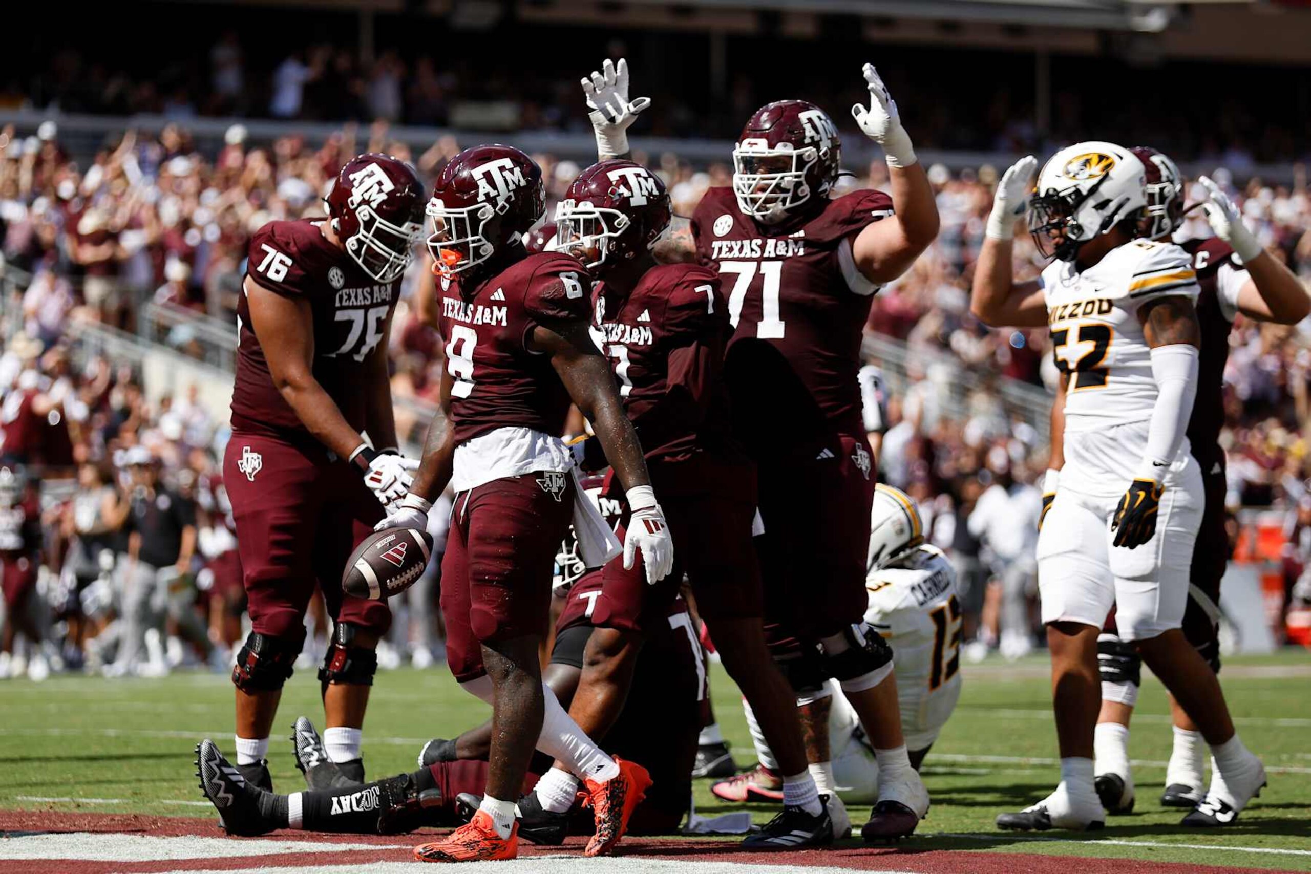 COLLEGE STATION, TEXAS - OCTOBER 05: Le'Veon Moss #8 of the Texas A&M Aggies reacts after rushing for a touchdown in the second quarter against the Missouri Tigers at Kyle Field on October 05, 2024 in College Station, Texas. (Photo by Tim Warner/Getty Images)