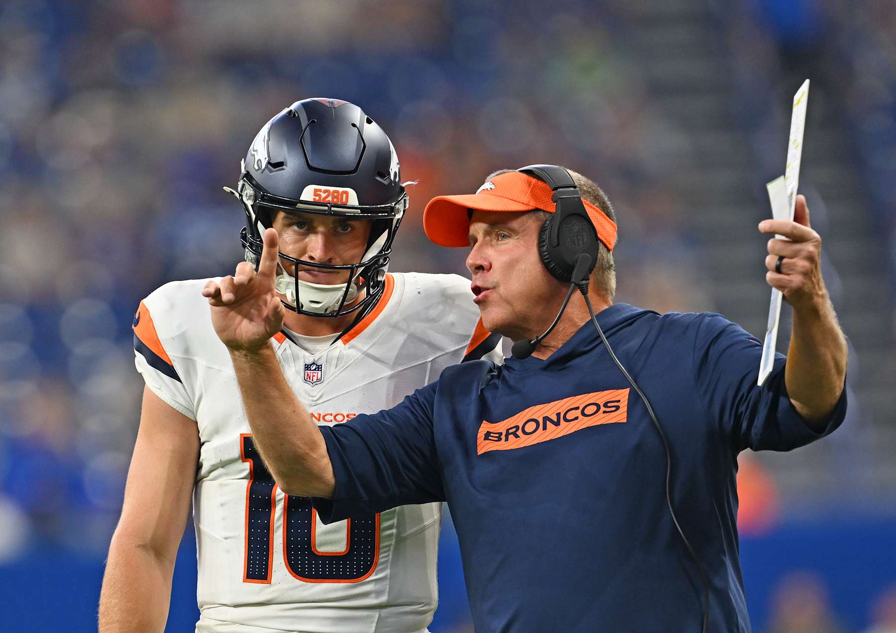 INDIANAPOLIS, INDIANA - AUGUST 11: Denver Broncos quarterback Bo Nix (10), left, talks with Denver Broncos head coach Sean Payton during a drive late in the 2nd quarter at Lucas Oil Stadium in Indianapolis, Indiana on August 11, 2024. The Indianapolis Colts hosted the Denver Broncos for their first NFL Preseason game of the 2024 summer. (Photo by RJ Sangosti/The Denver Post)