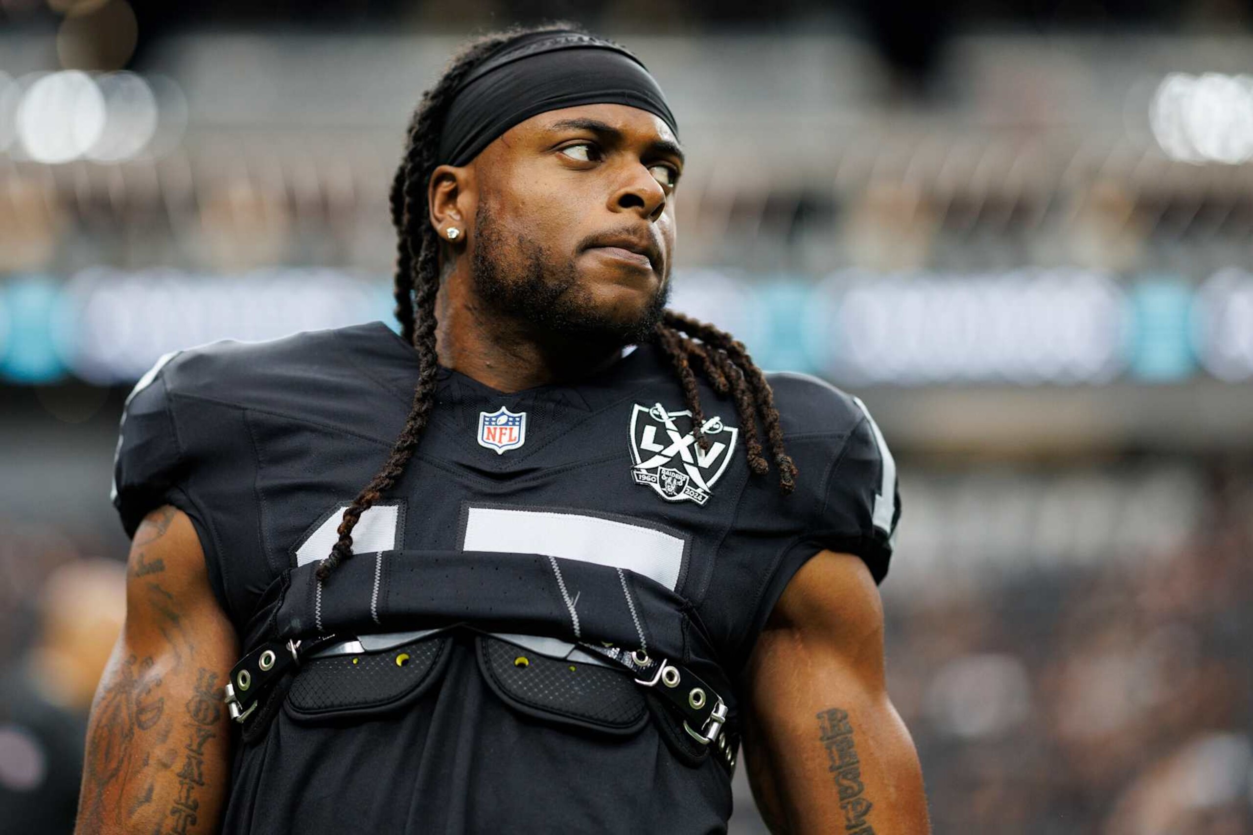 LAS VEGAS, NEVADA - SEPTEMBER 22: Wide receiver Davante Adams #17 of the Las Vegas Raiders stretches prior to an NFL football game against the Carolina Panthers, at Allegiant Stadium on September 22, 2024 in Las Vegas, Nevada. (Photo by Brooke Sutton/Getty Images) LAS VEGAS, NEVADA - SEPTEMBER 22: Wide receiver Davante Adams #17 of the Las Vegas Raiders stretches prior to an NFL football game against the Carolina Panthers, at Allegiant Stadium on September 22, 2024 in Las Vegas, Nevada. (Photo by Brooke Sutton/Getty Images)