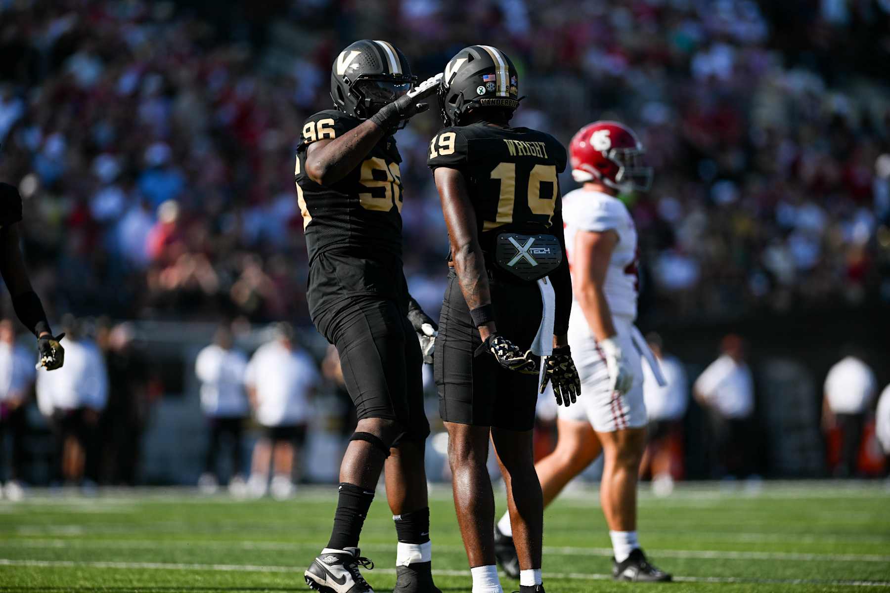 NASHVILLE, TENNESSEE - OCTOBER 5: De'Rickey Wright #19 and Khordae Sydnor #96 of the Vanderbilt Commodores celebrate a tackle against the Alabama Crimson Tide in the first half at FirstBank Stadium on October 5, 2024 in Nashville, Tennessee. (Photo by Carly Mackler/Getty Images)