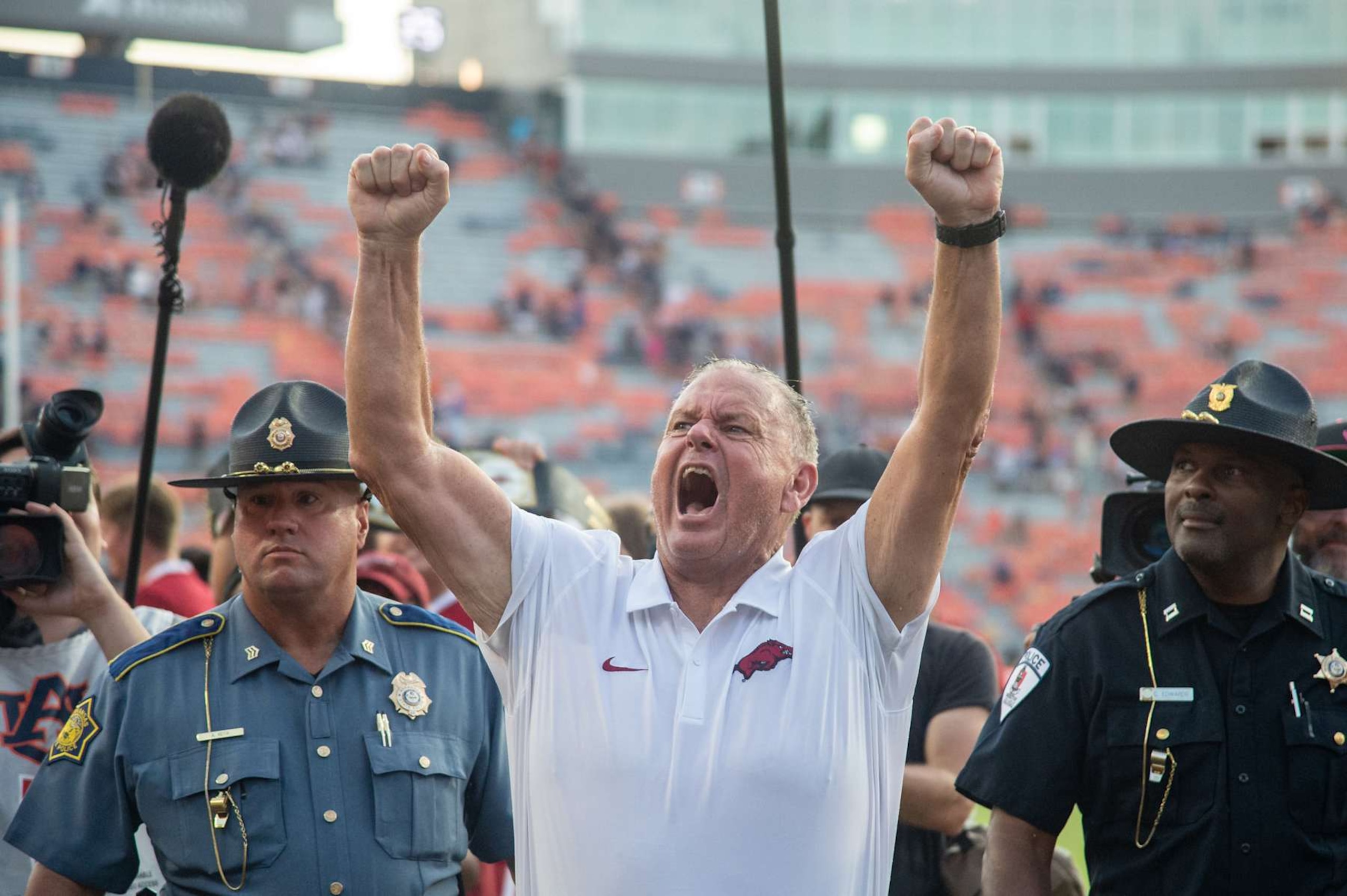AUBURN, ALABAMA - SEPTEMBER 21: Head coach Sam Pittman of the Arkansas Razorbacks celebrates after defeating the Auburn Tigers at Jordan-Hare Stadium on September 21, 2024 in Auburn, Alabama. (Photo by Michael Chang/Getty Images)