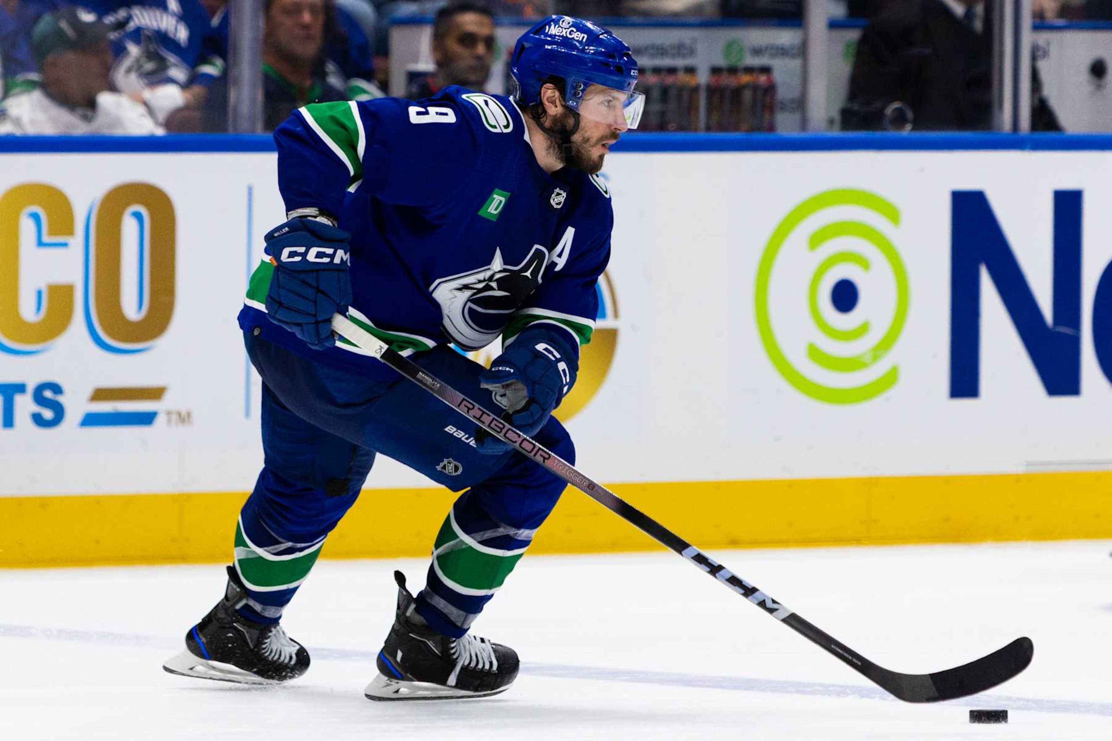 VANCOUVER, BC - MAY 20: Vancouver Canucks center J.T. Miller (9) with the puck during Game Seven of the Second Round of the 2024 Stanley Cup playoffs between the Edmonton Oilers and the Vancouver Canucks on May 20, 2024, at Rogers Arena in Vancouver, B.C. (Photo by Jamie Douglas/Icon Sportswire via Getty Images)