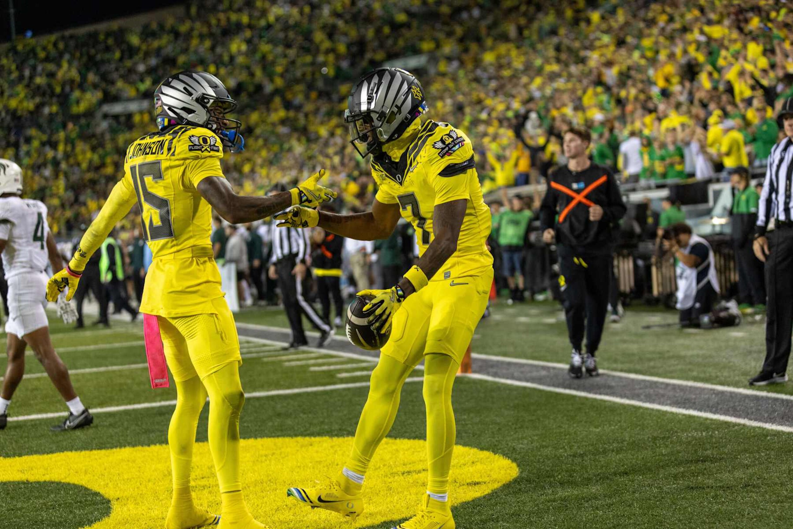 EUGENE, OREGON - OCTOBER 4: Wide receiver Evan Stewart #7 of the Oregon Ducks celebrates a touchdown with teammate Tez Johnson #15 of the Oregon Ducks during the first half against the Michigan State Spartans at Autzen Stadium on October 4, 2024 in Eugene, Oregon.  (Photo by Tom Hauck/Getty Images)