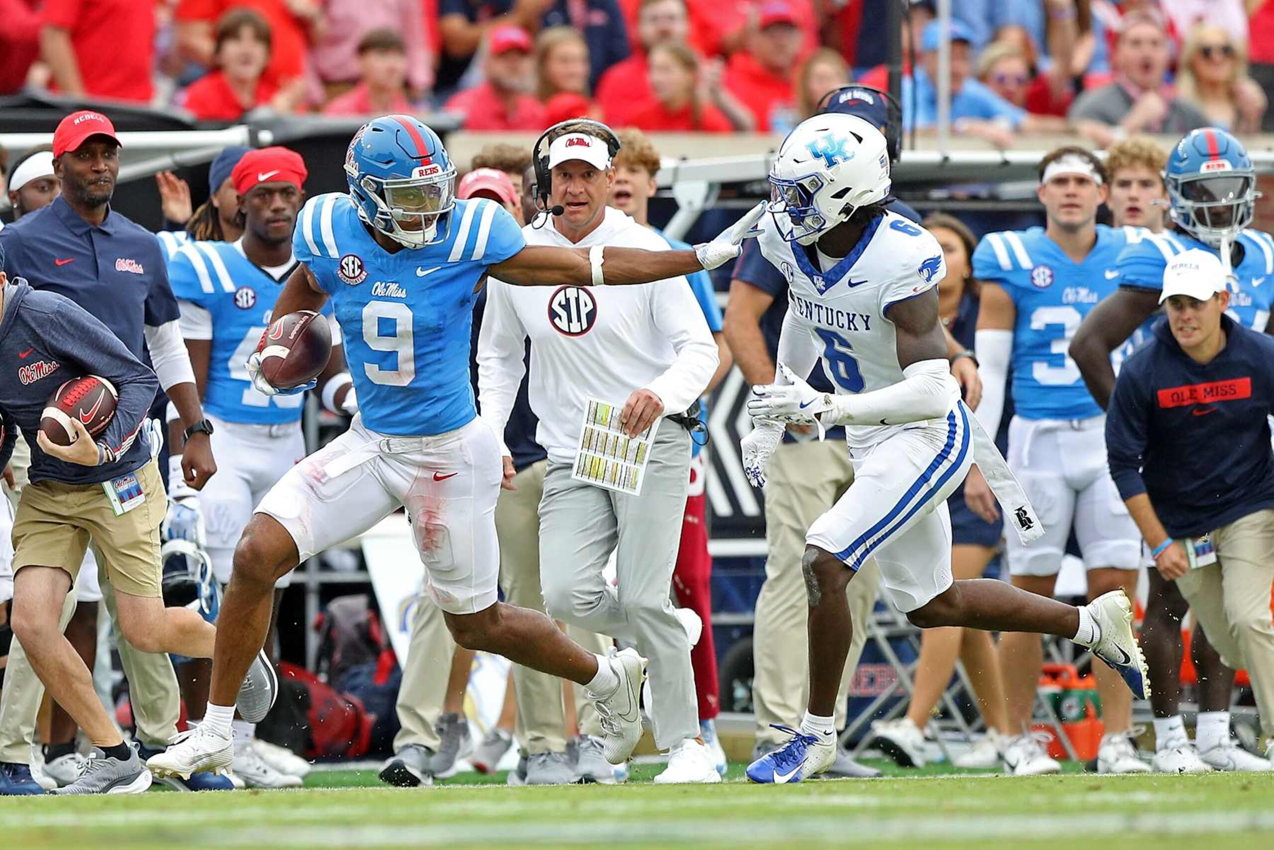 OXFORD, MISSISSIPPI - SEPTEMBER 28: Tre Harris #9 of the Mississippi Rebels catches the ball against JQ Hardaway #6 of the Kentucky Wildcats during the game at Vaught-Hemingway Stadium on September 28, 2024 in Oxford, Mississippi. (Photo by Justin Ford/Getty Images)