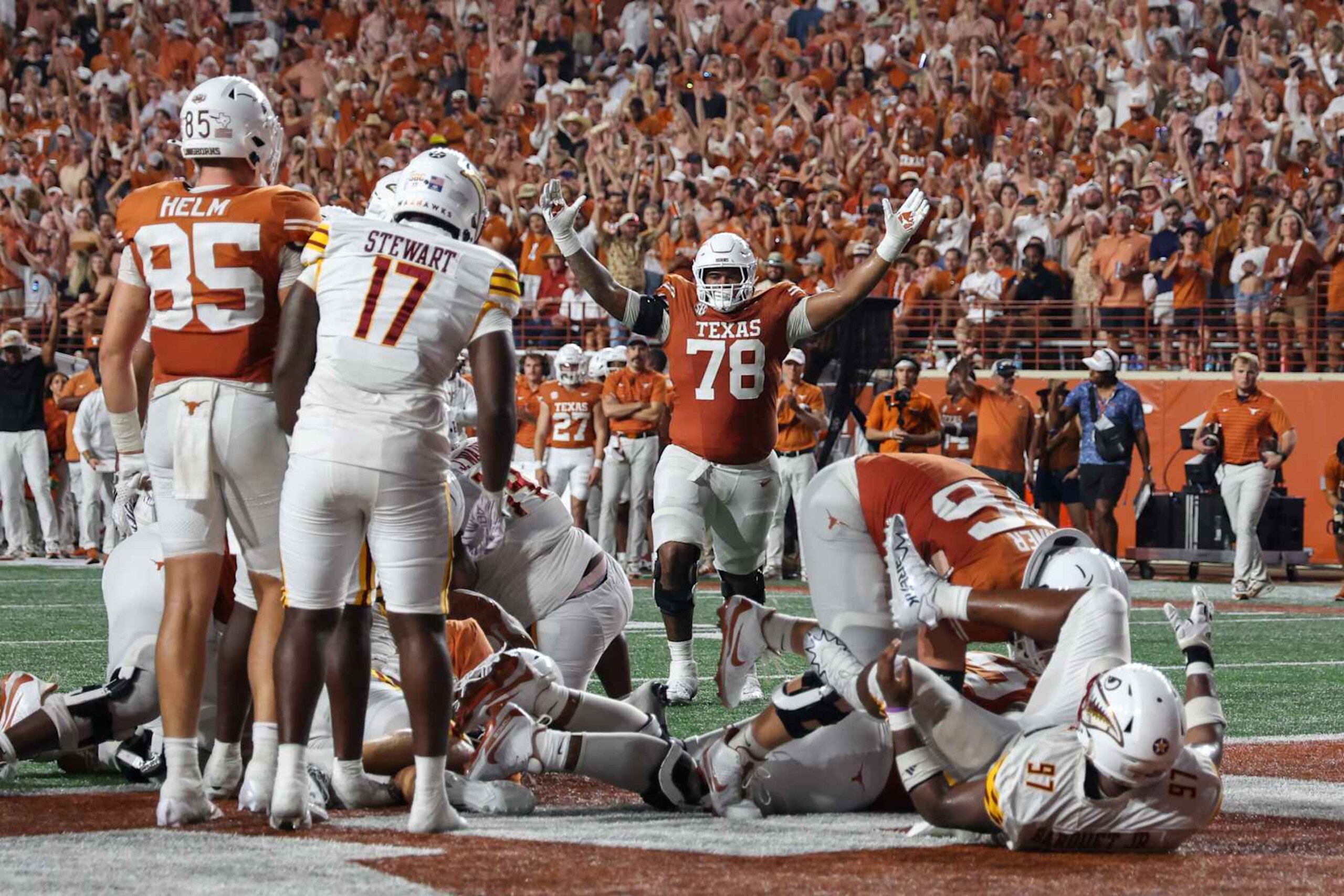 AUSTIN, TX - SEPTEMBER 21: Texas Longhorns offensive lineman Kelvin Banks Jr. (78) holds up the touchdown signal after his teammate Texas Longhorns running back Jaydon Blue (23) scores another touchdown during the college football game between Texas Longhorns and University of Louisiana Monroe Warhawks on September 21, 2024, at Darrell K Royal - Texas Memorial Stadium in Austin, TX.  (Photo by David Buono/Icon Sportswire via Getty Images)