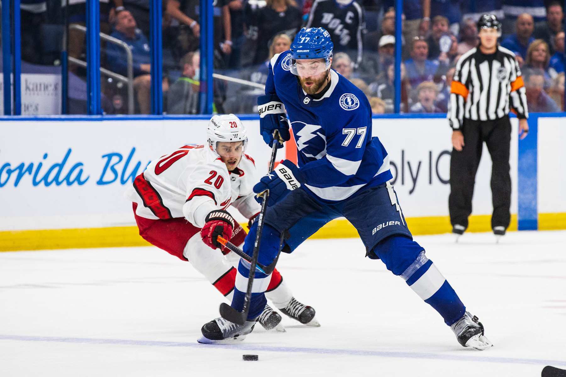 TAMPA, FL - June 3: Victor Hedman #77 of the Tampa Bay Lightning skates against Sebastian Aho #20 of the Carolina Hurricanes during the third period in Game Three of the Second Round of the 2021 Stanley Cup Playoffs at Amalie Arena on June 3, 2021 in Tampa, Florida. (Photo by Scott Audette/NHLI via Getty Images)