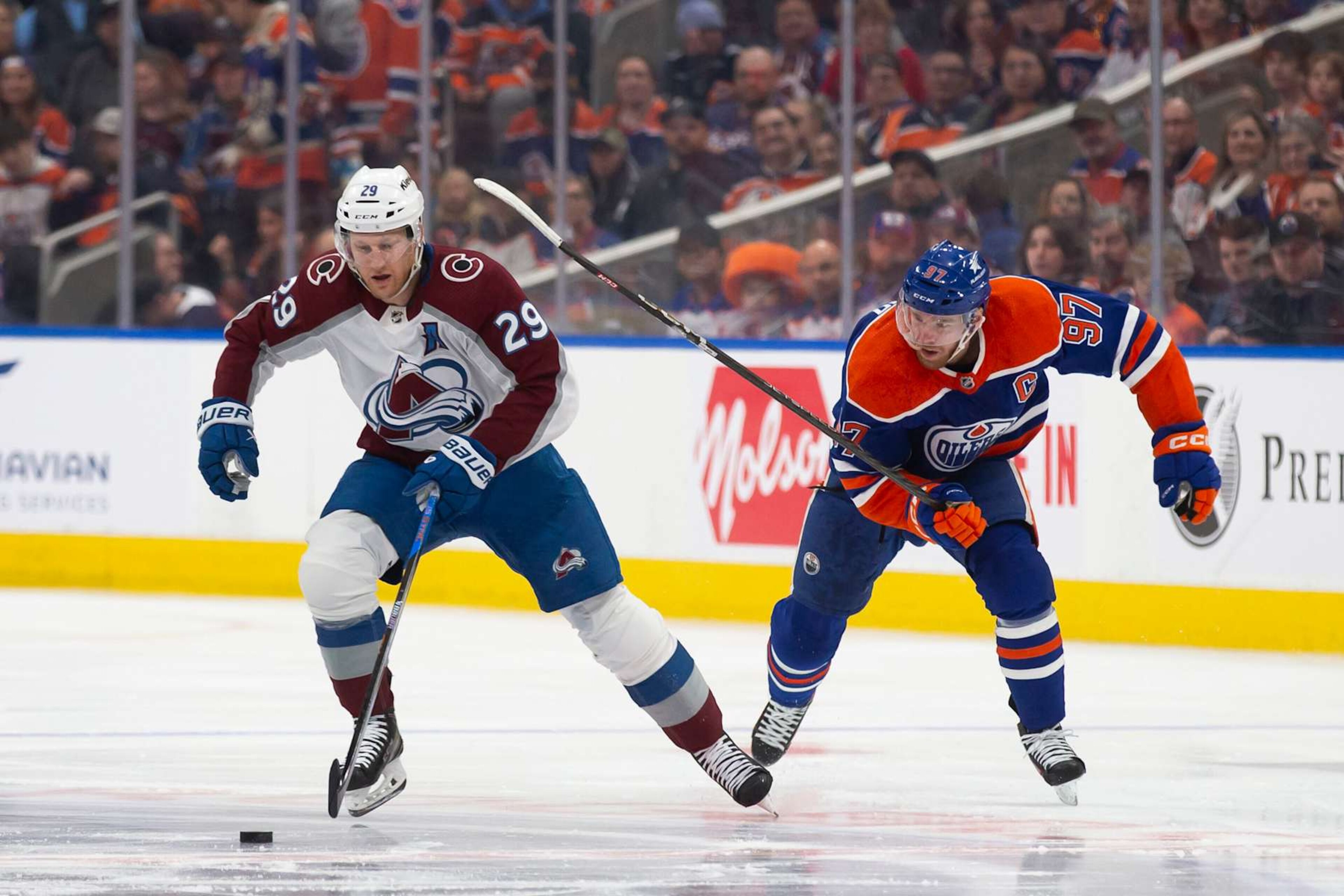EDMONTON, CANADA - APRIL 5: Connor McDavid #97 of the Edmonton Oilers skates against Nathan MacKinnon #29 of the Colorado Avalanche during the first period at Rogers Place on April 5, 2024 in Edmonton, Canada. (Photo by Codie McLachlan/Getty Images) EDMONTON, CANADA - APRIL 5: Connor McDavid #97 of the Edmonton Oilers skates against Nathan MacKinnon #29 of the Colorado Avalanche during the first period at Rogers Place on April 5, 2024 in Edmonton, Canada. (Photo by Codie McLachlan/Getty Images)