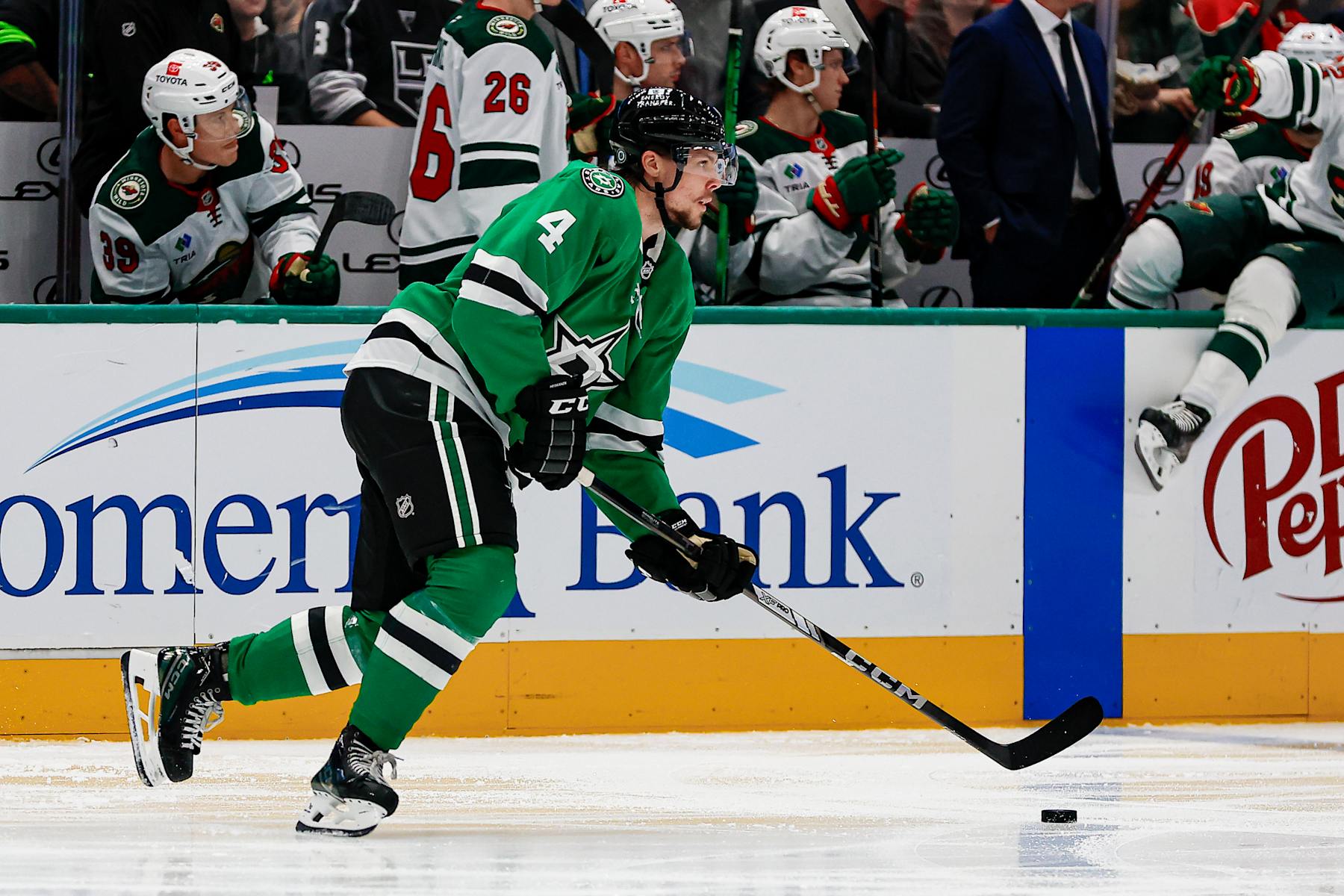 DALLAS, TX - SEPTEMBER 27: Dallas Stars defenseman Miro Heiskanen (4) skates with the puck during the game between the Dallas Stars and the Minnesota Wild on September 25, 2024 at American Airlines Center in Dallas, Texas. (Photo by Matthew Pearce/Icon Sportswire via Getty Images)
