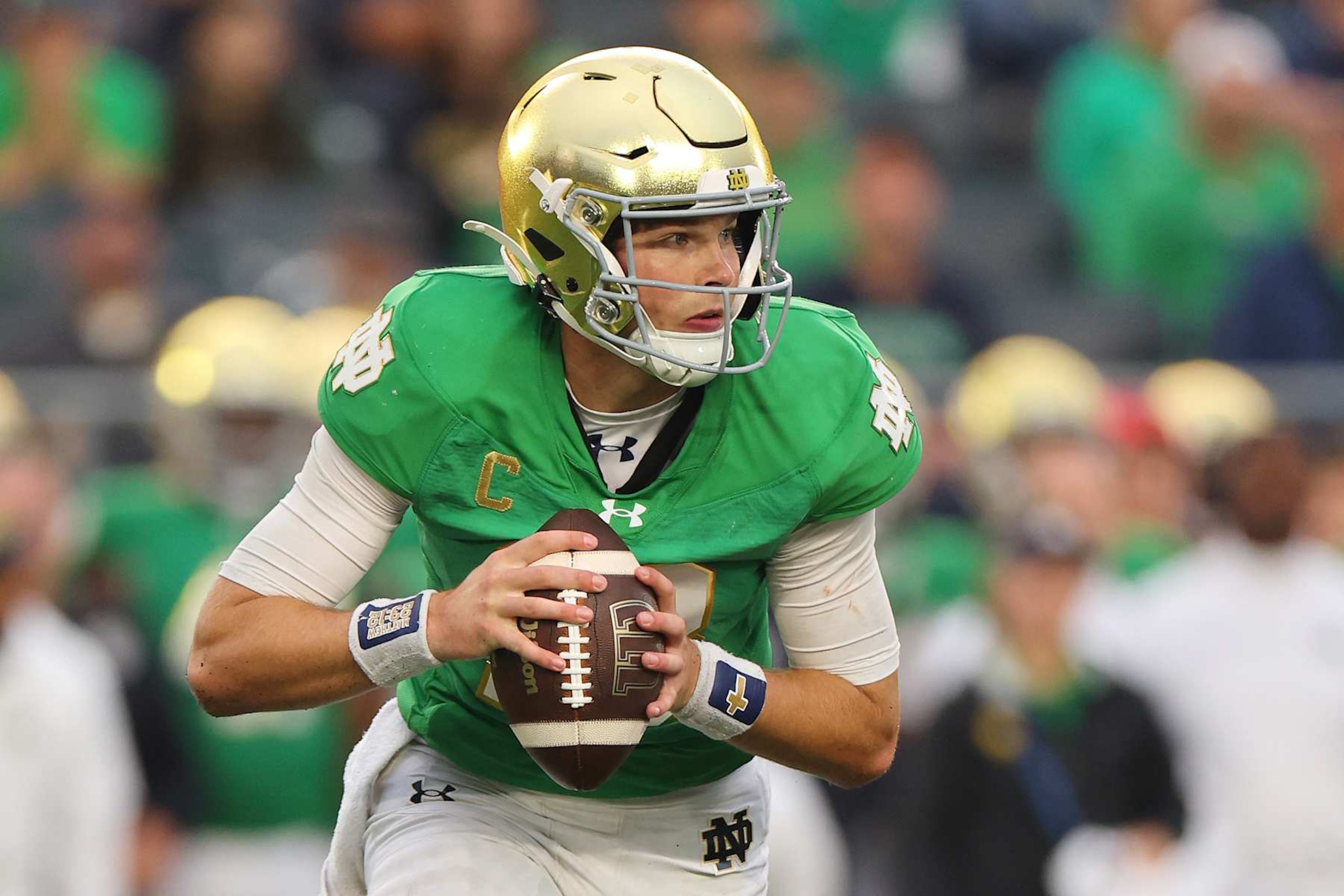 SOUTH BEND, INDIANA - SEPTEMBER 28: Riley Leonard #13 of the Notre Dame Fighting Irish scrambles with the ball against the Louisville Cardinals during the second half at Notre Dame Stadium on September 28, 2024 in South Bend, Indiana. (Photo by Michael Reaves/Getty Images)