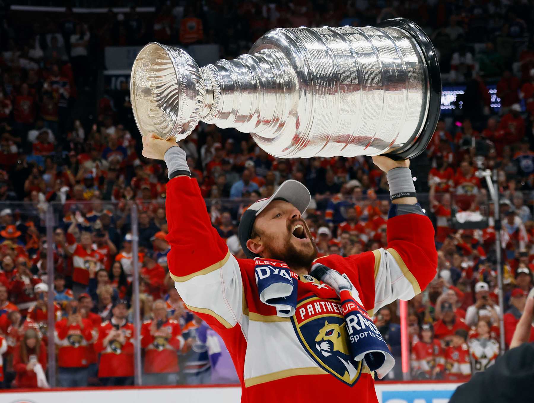 SUNRISE, FLORIDA - JUNE 24: Sam Reinhart #13 of the Florida Panthers celebrates with the Stanley Cup following a 2-1 victory over the Edmonton Oilers in Game Seven of the 2024 NHL Stanley Cup Final at Amerant Bank Arena on June 24, 2024 in Sunrise, Florida. (Photo by Bruce Bennett/Getty Images)