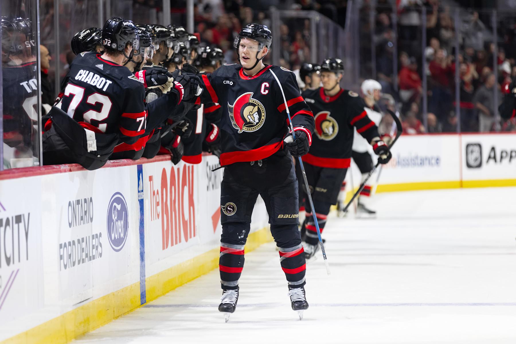 OTTAWA, ON - APRIL 06: Ottawa Senators Left Wing Brady Tkachuk (7) skates by the bench to celebrate his goal  during third period National Hockey League action between the New Jersey Devils and Ottawa Senators on April 6, 2024, at Canadian Tire Centre in Ottawa, ON, Canada. (Photo by Richard A. Whittaker/Icon Sportswire via Getty Images)