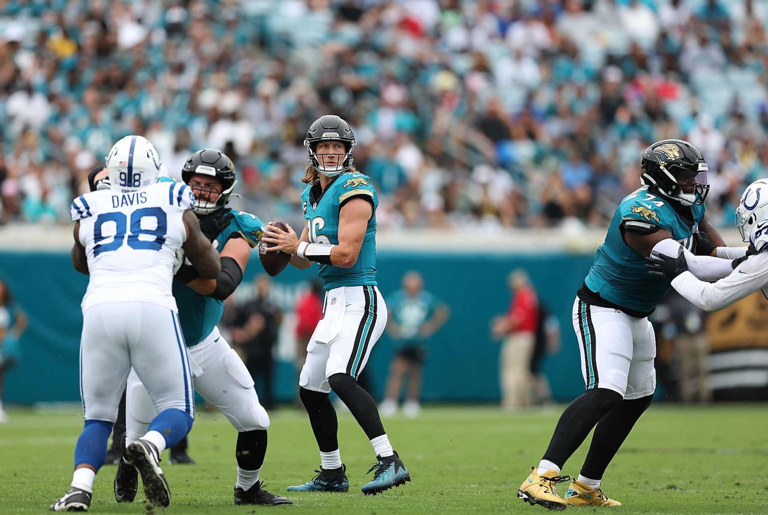 Jaguars quarterback Trevor Lawrence drops back to pass against the Colts. Jaguars quarterback Trevor Lawrence drops back to pass against the Colts.