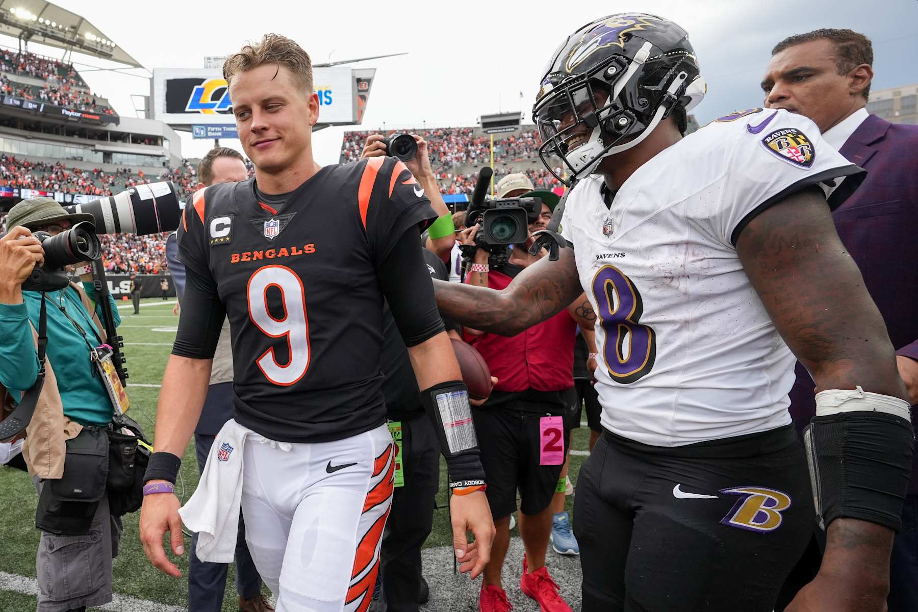CINCINNATI, OHIO - SEPTEMBER 17: Joe Burrow #9 of the Cincinnati Bengals and Lamar Jackson #8 of the Baltimore Ravens meet after the Ravens beat the Bengals 27-24 at Paycor Stadium on September 17, 2023 in Cincinnati, Ohio. (Photo by Dylan Buell/Getty Images)