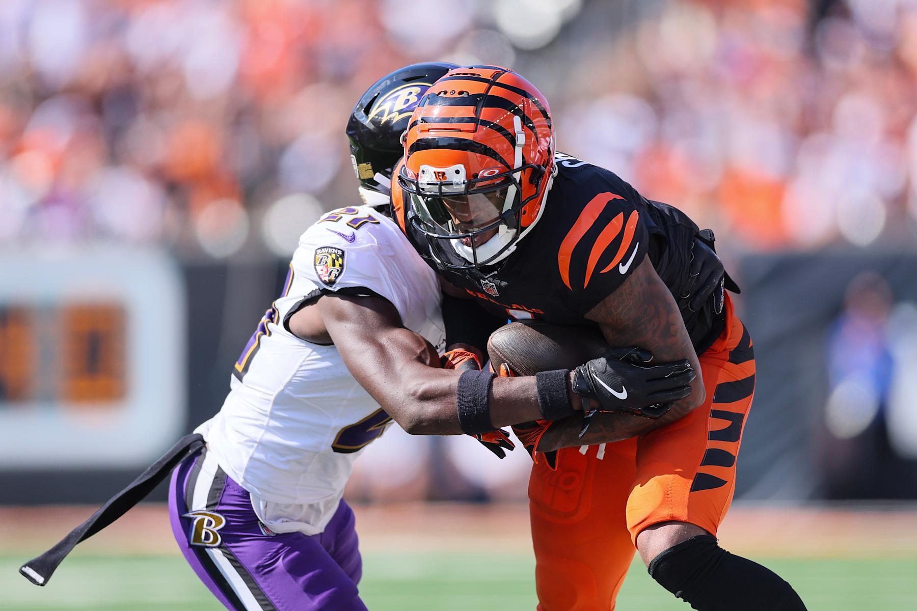 Bengals WR Ja'Marr Chase is tackled by Ravens CB Brandon Stephens. 
