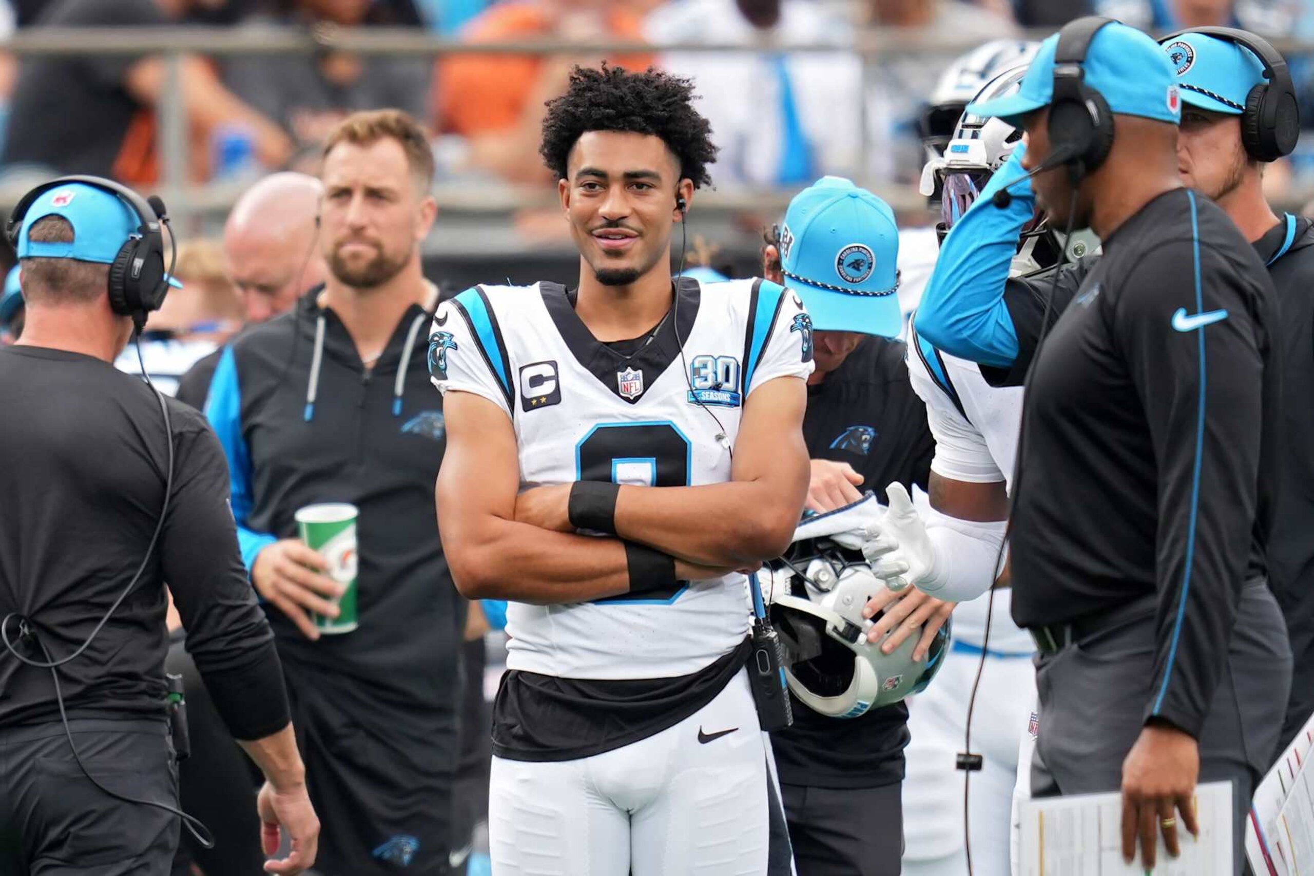 CHARLOTTE, NORTH CAROLINA - SEPTEMBER 29: Bryce Young #9 of the Carolina Panthers looks on from the sidelines during the first quarter against the Cincinnati Bengals at Bank of America Stadium on September 29, 2024 in Charlotte, North Carolina. (Photo by Grant Halverson/Getty Images)