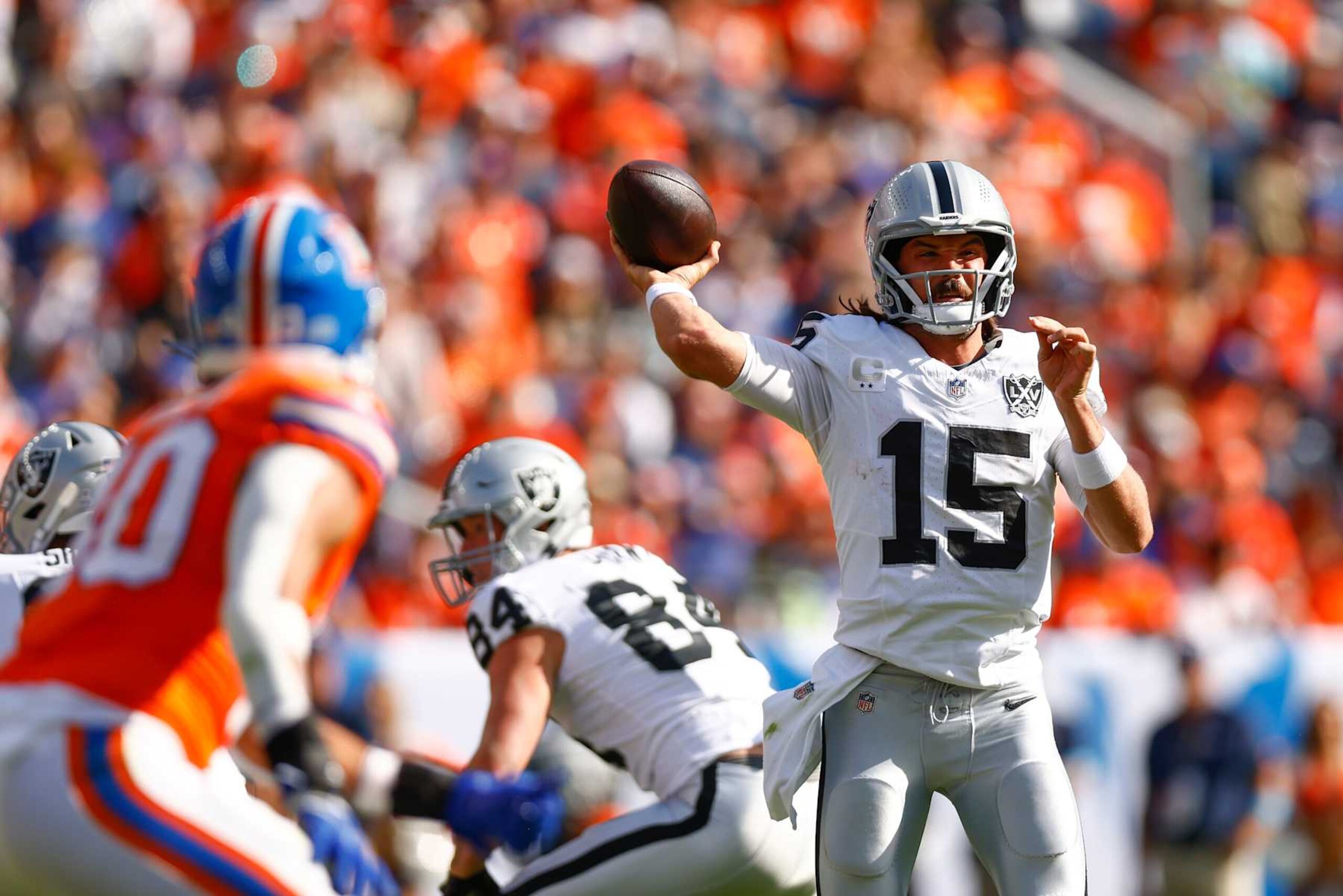DENVER, COLORADO - OCTOBER 06: Gardner Minshew #15 of the Las Vegas Raiders throws a pass against the Denver Broncos during the second quarter at Empower Field At Mile High on October 06, 2024 in Denver, Colorado. (Photo by Justin Edmonds/Getty Images)
