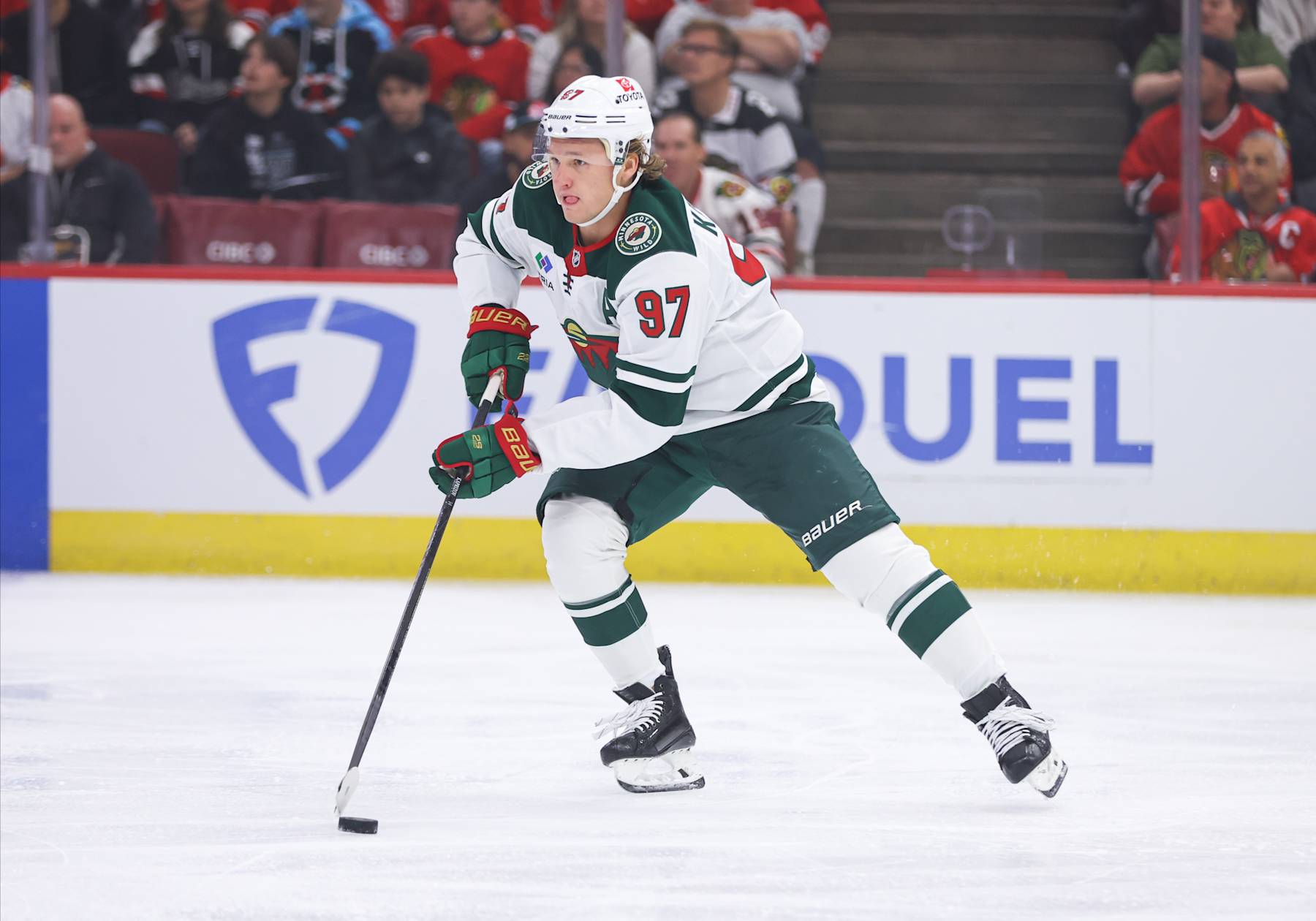 CHICAGO, IL - OCTOBER 04: Minnesota Wild left wing Kirill Kaprizov #97 controls the puck during the first period of a preseason game against the Chicago Blackhawks on October 4, 2024 at the United Center in Chicago,Illinois. (Photo by Melissa Tamez/Icon Sportswire via Getty Images)