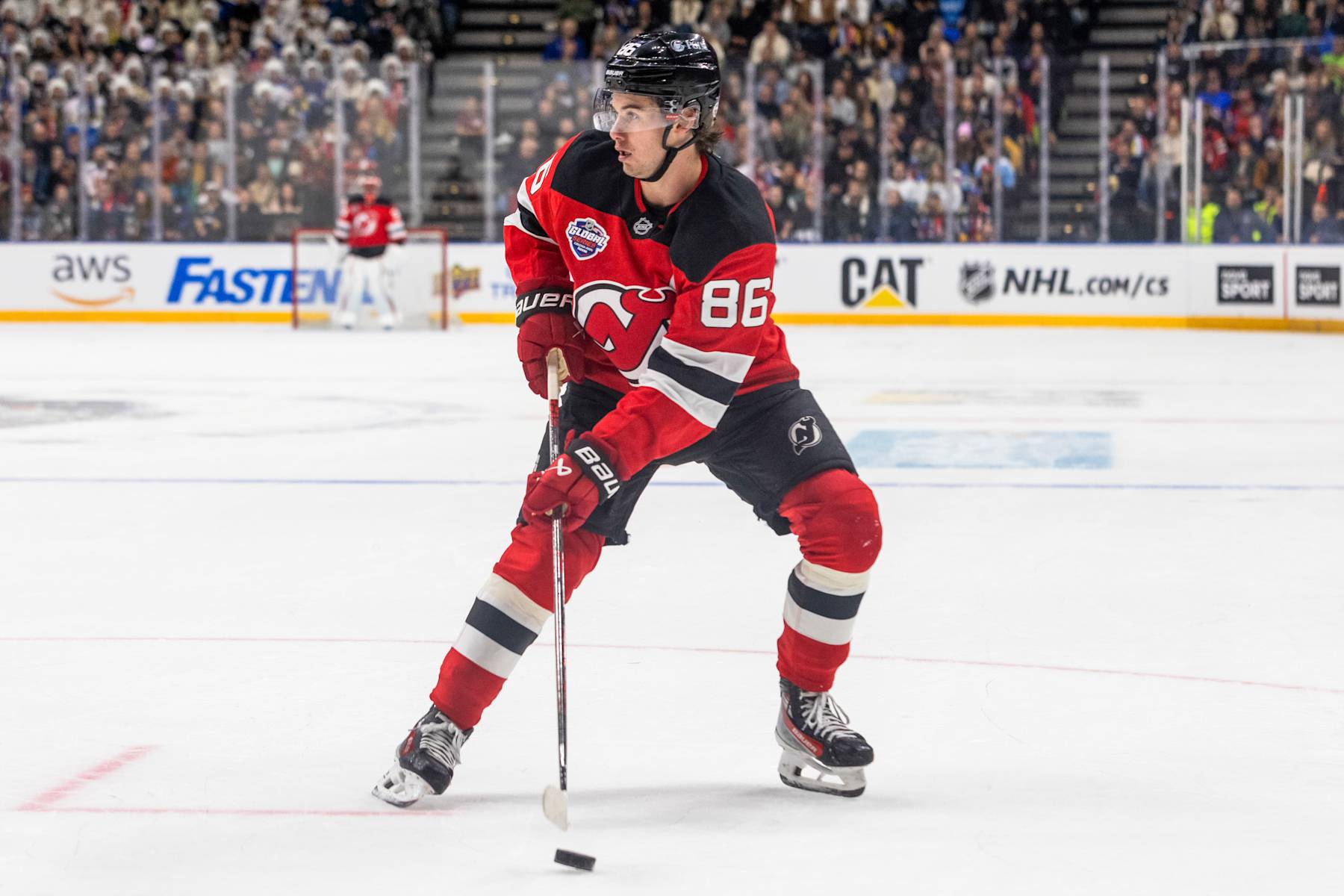 PRAGUE, CZECH REPUBLIC - OCTOBER 05: Jack Hughes #86 of the New Jersey Devils looks to pass the puck during the first period of the 2024 NHL Global Series Czechia against the Buffalo Sabres on October 05, 2024 in Prague, Czech Republic. (Photo by Andrew Maclean /NHLI via Getty Images)