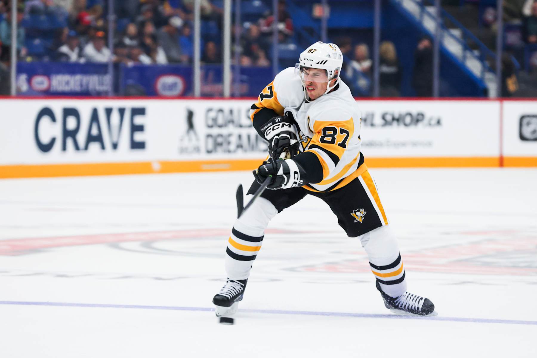 SUDBURY, CANADA - SEPTEMBER 29: Sidney Crosby #87 of the Pittsburgh Penguins shoots the puck during the third period of the NHL Kraft Hockeyville pre-season game against the Ottawa Senators at Sudbury Community Arena on September 29, 2024 in Sudbury, Ontario. (Photo by Dave Sandford/NHLI via Getty Images)