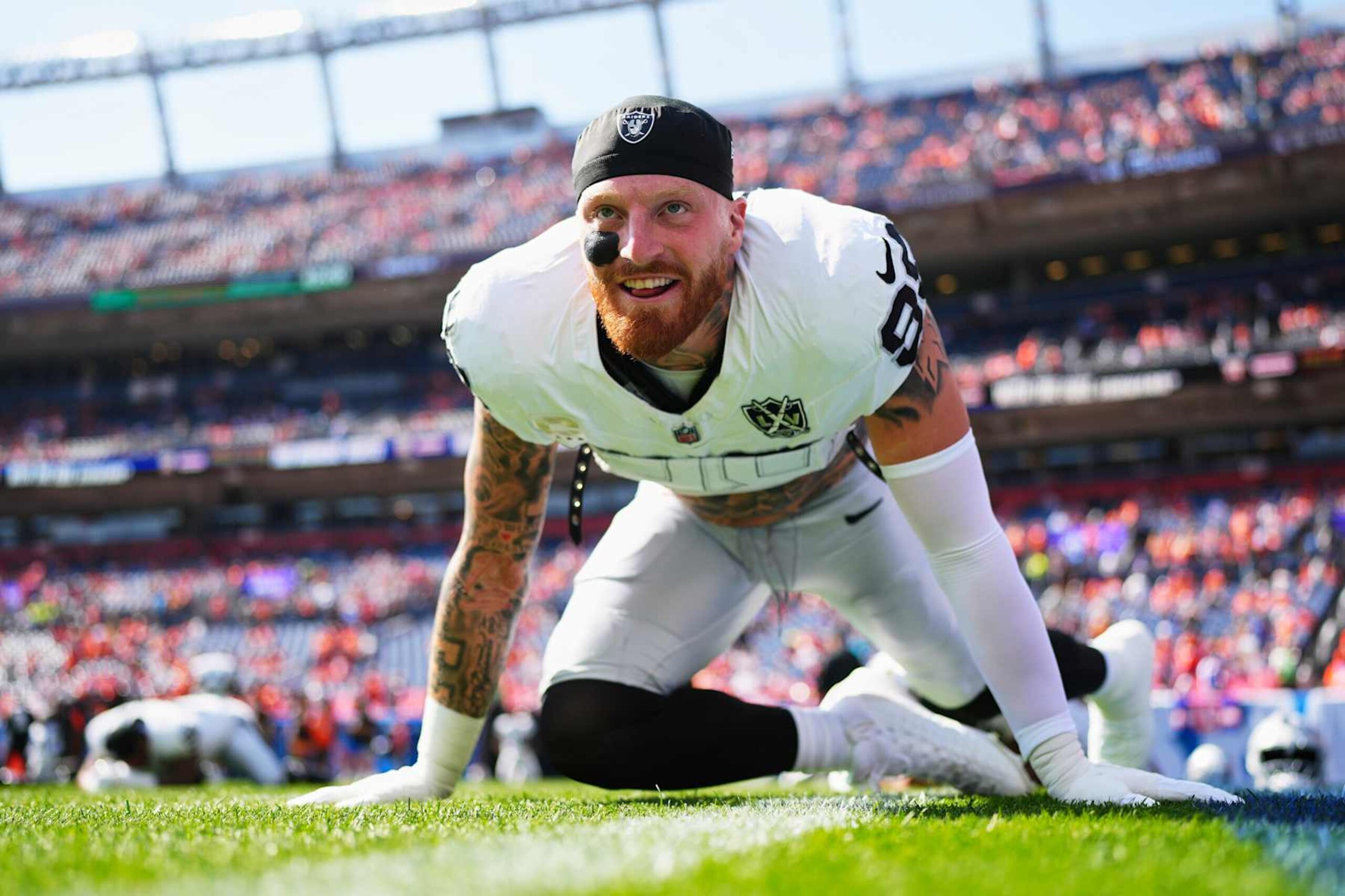 DENVER, CO - OCTOBER 06: Maxx Crosby #98 of the Las Vegas Raiders warms up before kickoff against the Denver Broncos during an NFL football game at Empower Field at Mile High on October 6, 2024 in Denver, Colorado. (Photo by Cooper Neill/Getty Images)